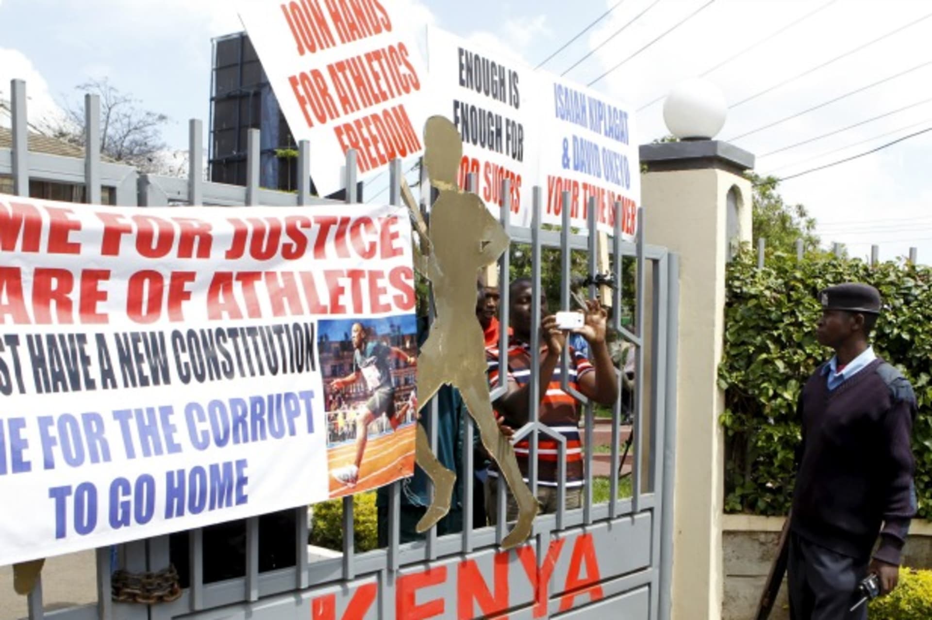 <p>A policeman is seen outside the gates of Riadha House the Athletic Kenya (AK) Headquarters during a protest in capital Nairobi…ding that top Athletics Kenya (AK) bosses step down following allegations of graft and doping cover-ups (Reuters/Noor Khamis).</p>
