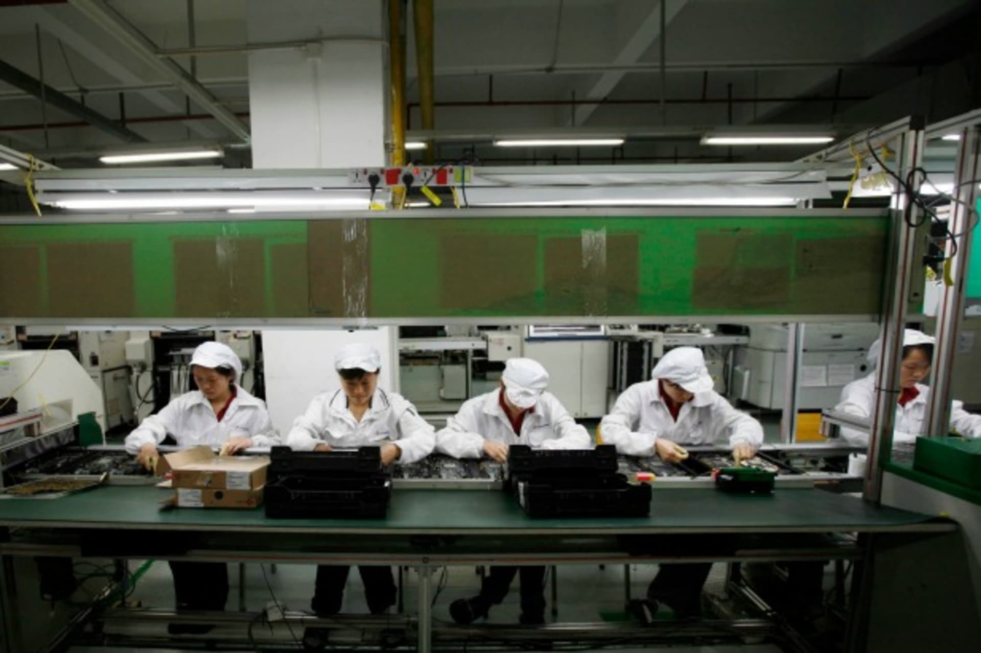 <p>Workers are seen inside a Foxconn factory in the township of Longhua in the southern Guangdong province May 26, 2010. A spate …nes, has cast a spotlight on some of the harsher aspects of blue-collar life on the Chinese factory floor (Reuters/Bobby Yip).</p>
