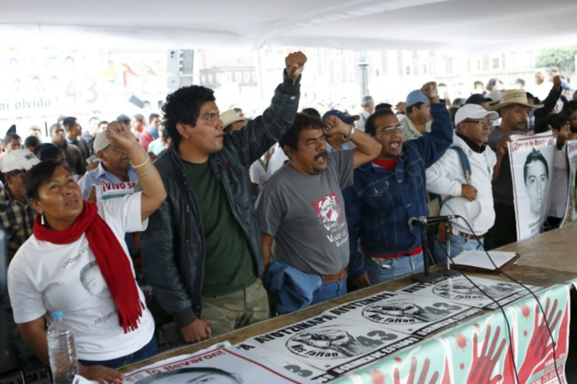 <p>Relatives hold pictures of some of the 43 missing students of Ayotzinapa College Raul Isidro Burgos and shout during a news co…h Mexico’s President Enrique Pena Nieto, ahead of the first anniversary of the students’ disappearance (Reuters/Henry Romero).</p>
