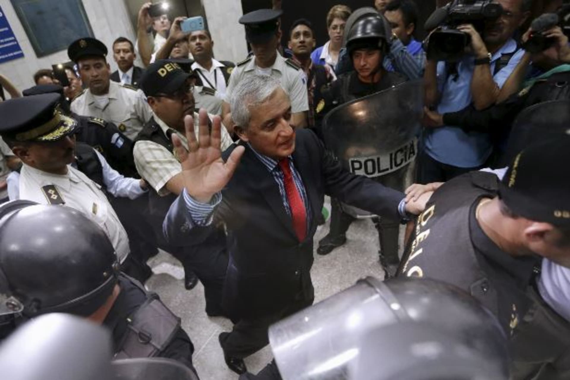 <p>Guatemala’s former President Otto Perez Molina gestures while being escorted by police officers after a hearing at the Supreme…uit overnight. Vice President Alejandro Maldonado will fill out the remaining months of Perez’ term (Jorge Dan Lopez/Reuters).</p>
