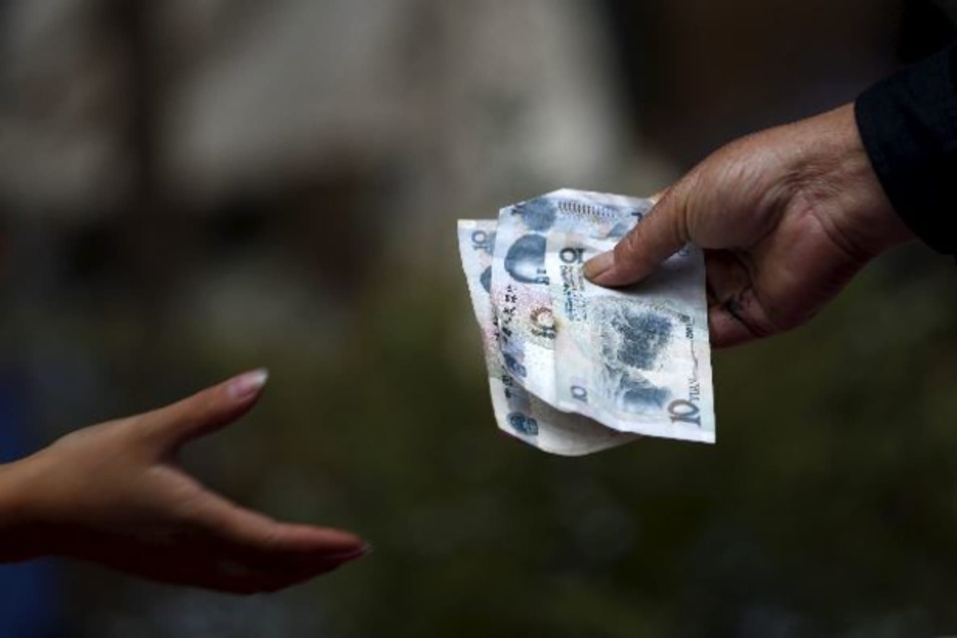 <p>A vendor selling flowers hands over change to a customer in Kunming, Yunnan province, August 19, 2015. China’s currency devalu…t the surprise surge in volatility, but its longer-term impact on market activity may not be so benign (Wong Campion/Reuters).</p>
