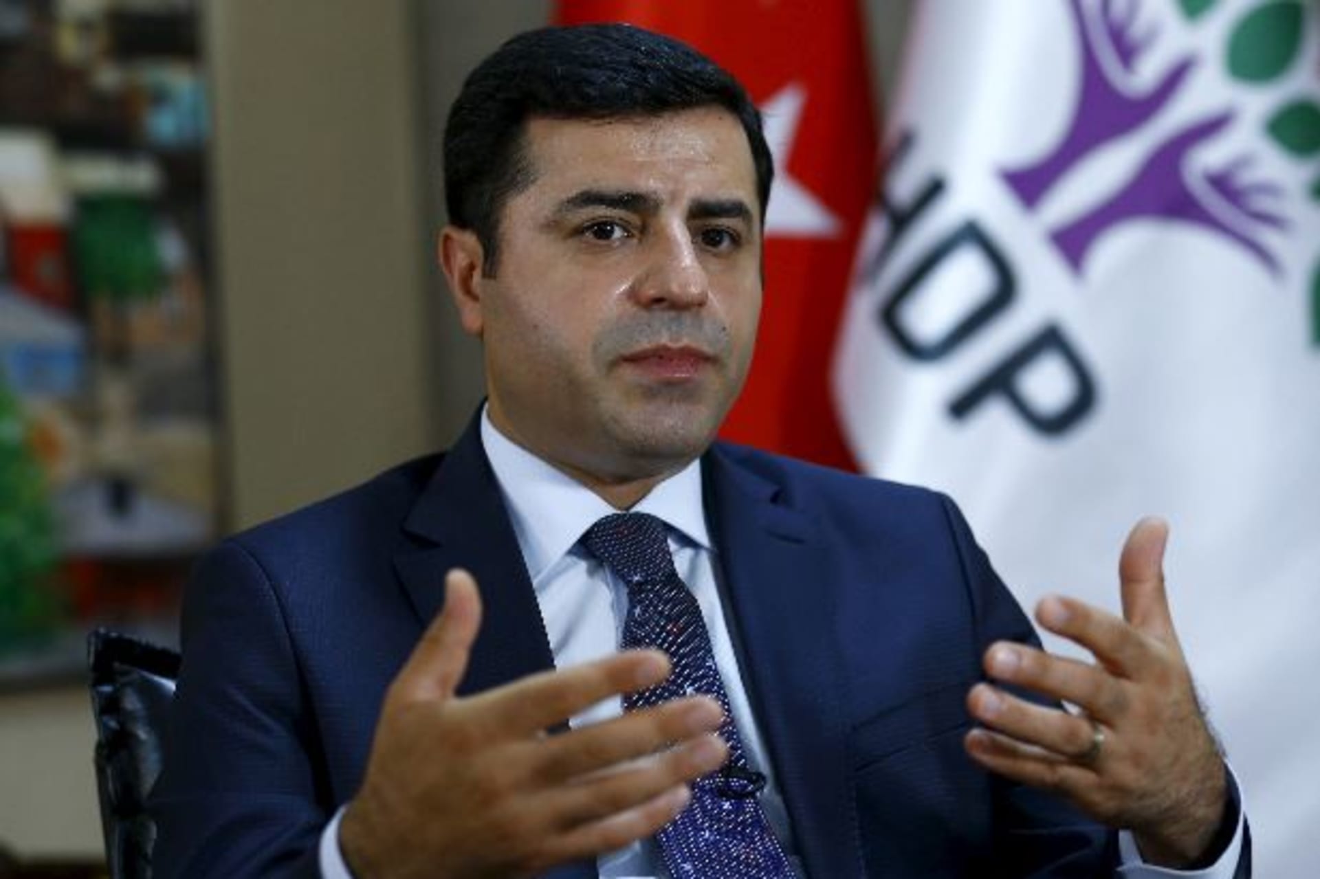 <p>The leader of Turkey’s pro-Kurdish opposition Peoples’ Democratic Party (HDP) Selahattin Demirtas answers a question during an…n the HDP entered parliament as a party for the first time. To match Interview MIDEAST-CRISIS/TURKEY-KURDS REUTERS/Umit Bektas</p>
