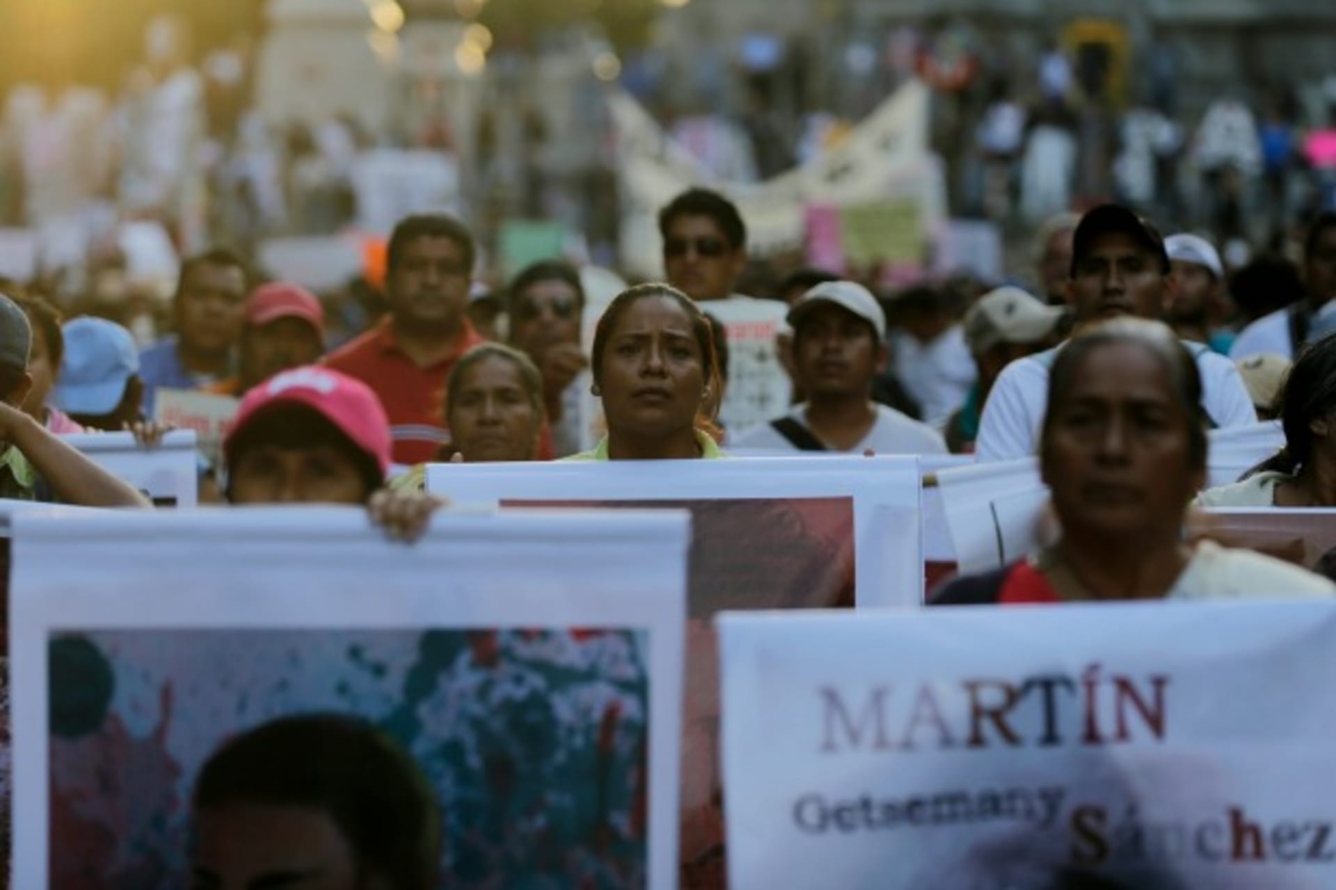 <p>Relatives of the 43 missing students of the Ayotzinapa teachers’ training college hold pictures of the students during a demonstration to demand justice, in Mexico City, November 5, 2014 (Courtesy Reuters/Tomas Bravo).</p>
