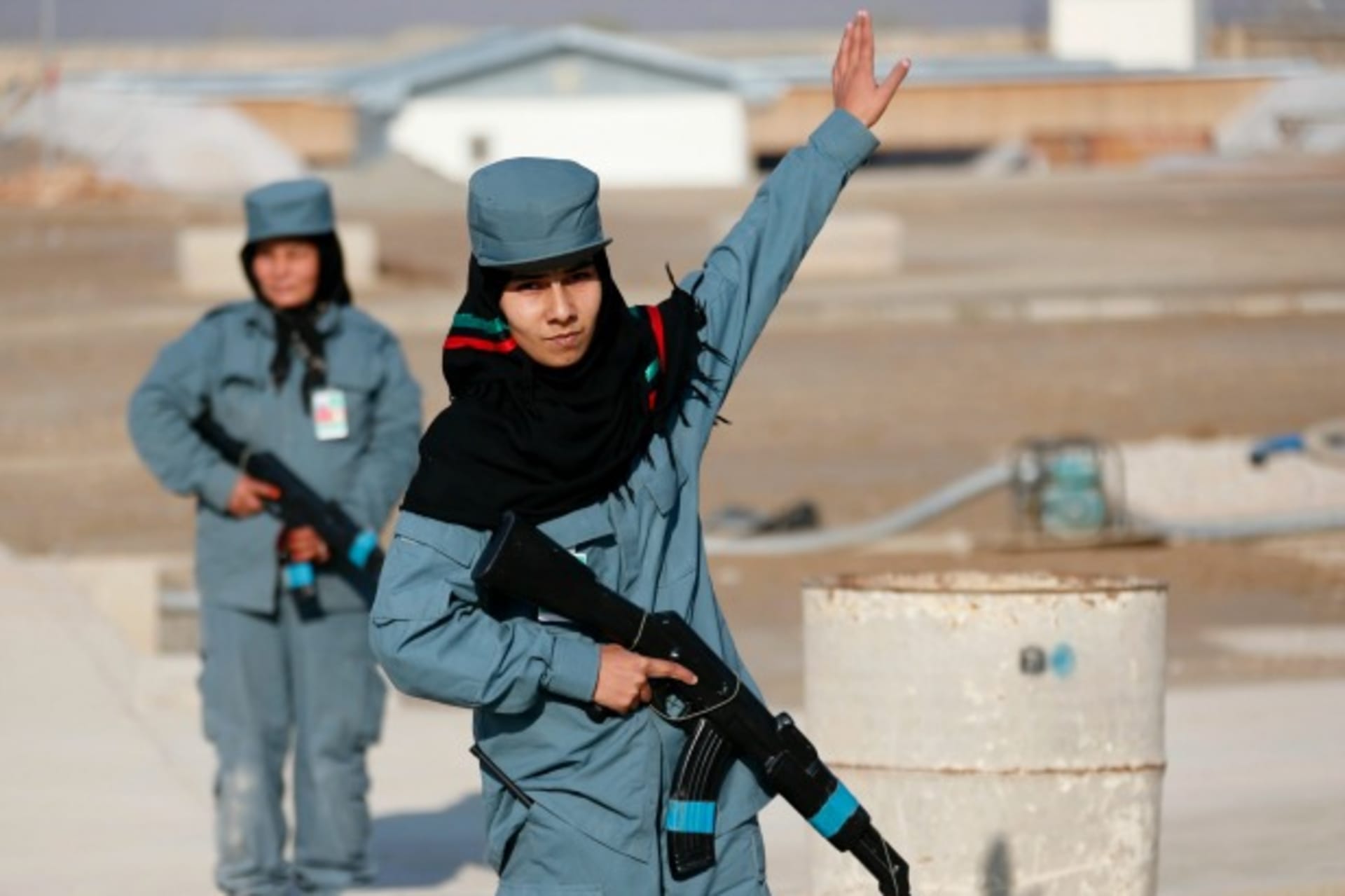 <p>A female Afghan National Police (ANP) officer gives instructions during a patrol training session, at a training center near the German Bundeswehr army camp in Kunduz, northern Afghanistan, December 2012 (Courtesy Fabrizio Bensch/Reuters).</p>
