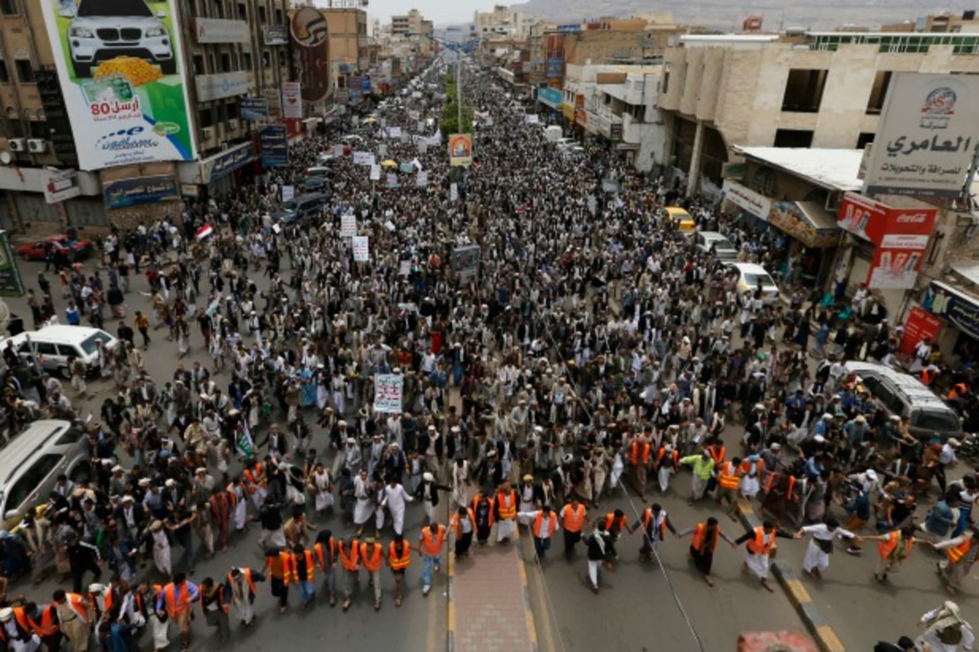 <p>Anti-government protesters march during a demonstration to denounce fuel prices hikes in Sanaa, Yemen, August 4, 2014 (Courtesy Reuters/Khaled Abdullah).</p>
