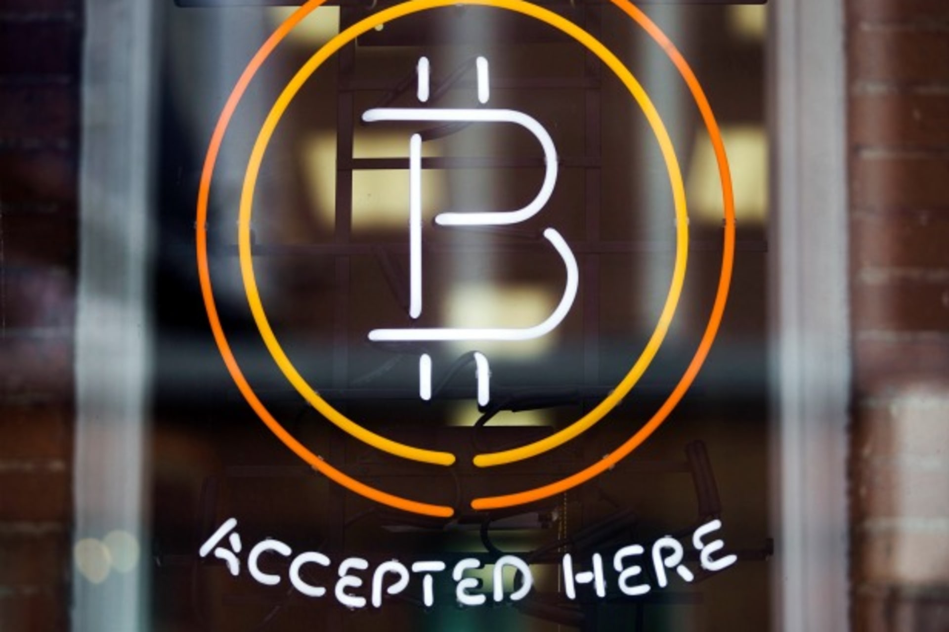 <p>A Bitcoin sign is seen in a window in Toronto, Canada, May 2014 (Courtesy Reuters/Mark Blinch).</p>
