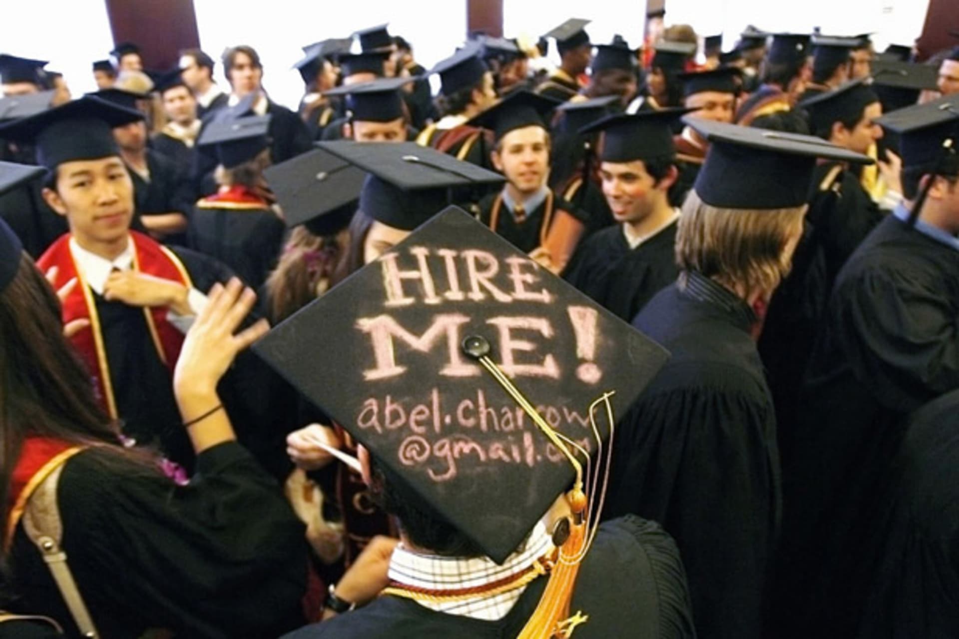 <p>Graduating student Abel Charron hire me mortar board USC School Cinematic Arts commencement University Southern California</p>
