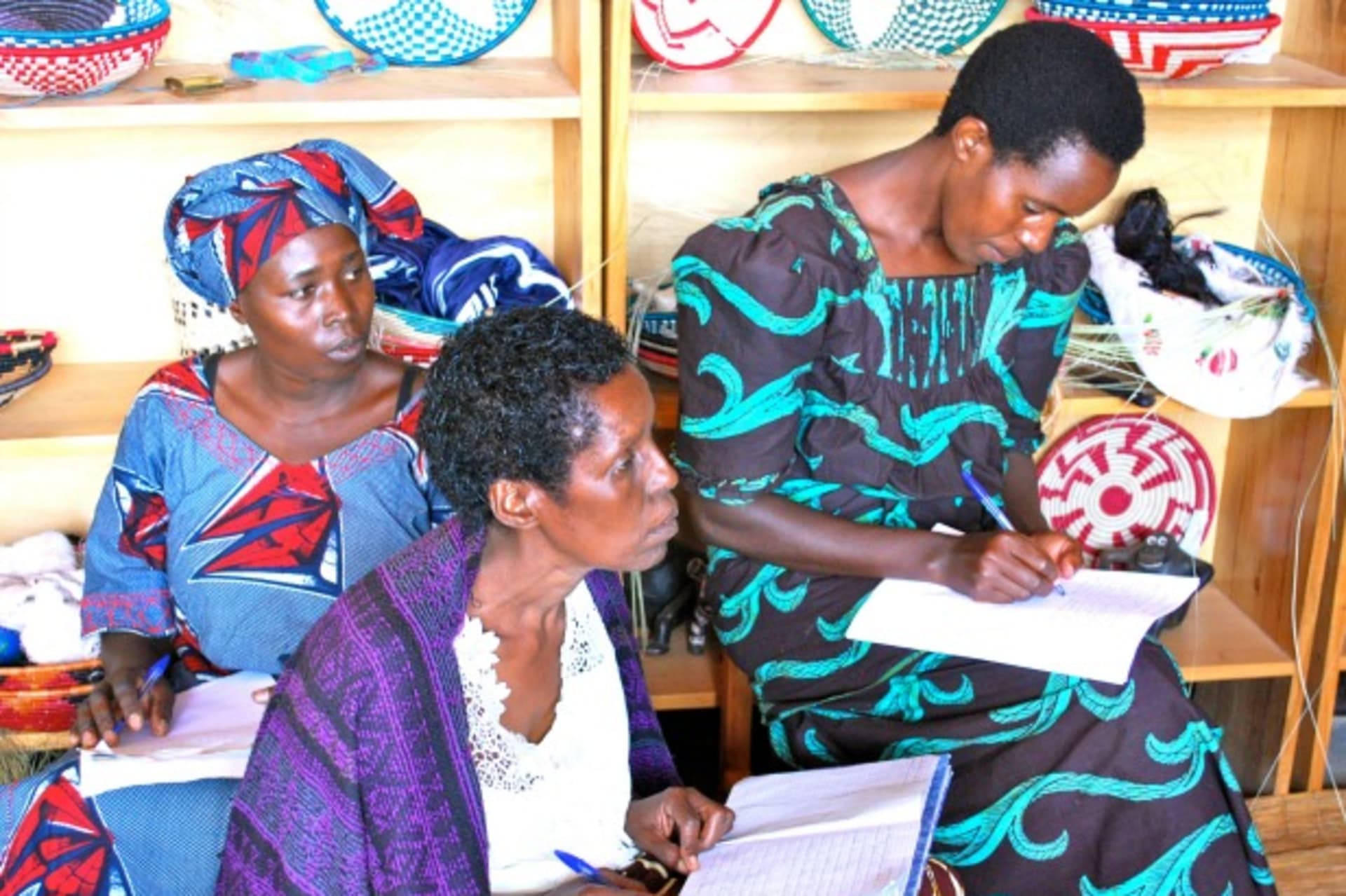 <p>Artisan entrepreneurs receive business training from Indego Africa at their cooperative, Covanya, in Nyamata, Rwanda, 2011 (Courtesy Benjamin D. Stone, copyright Indego Africa).</p>