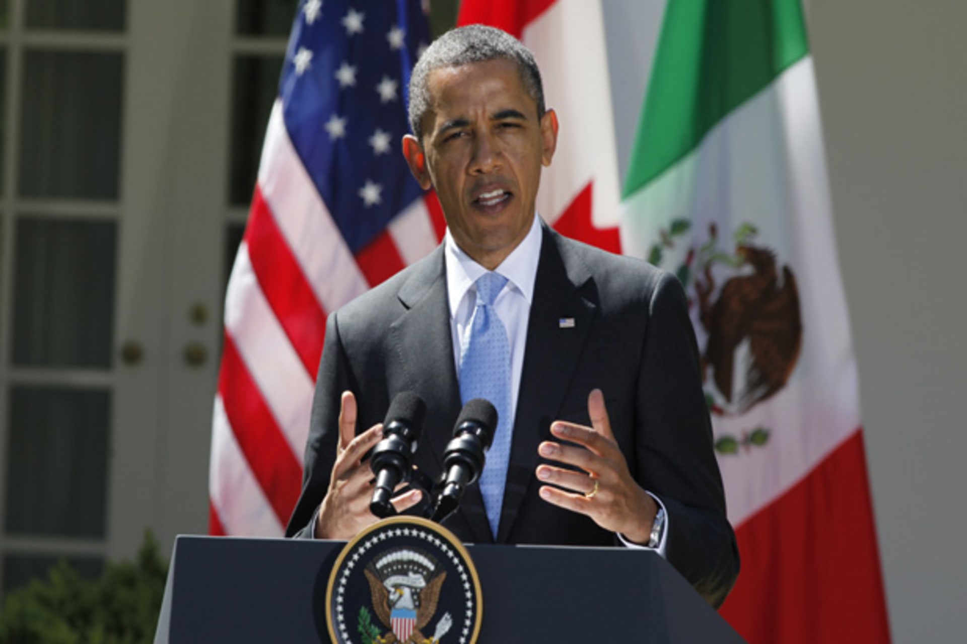 U.S. President Obama addresses news conference with Canada's Prime Minister Harper and Mexico's President Calderon in the White House Rose Garden in Washington