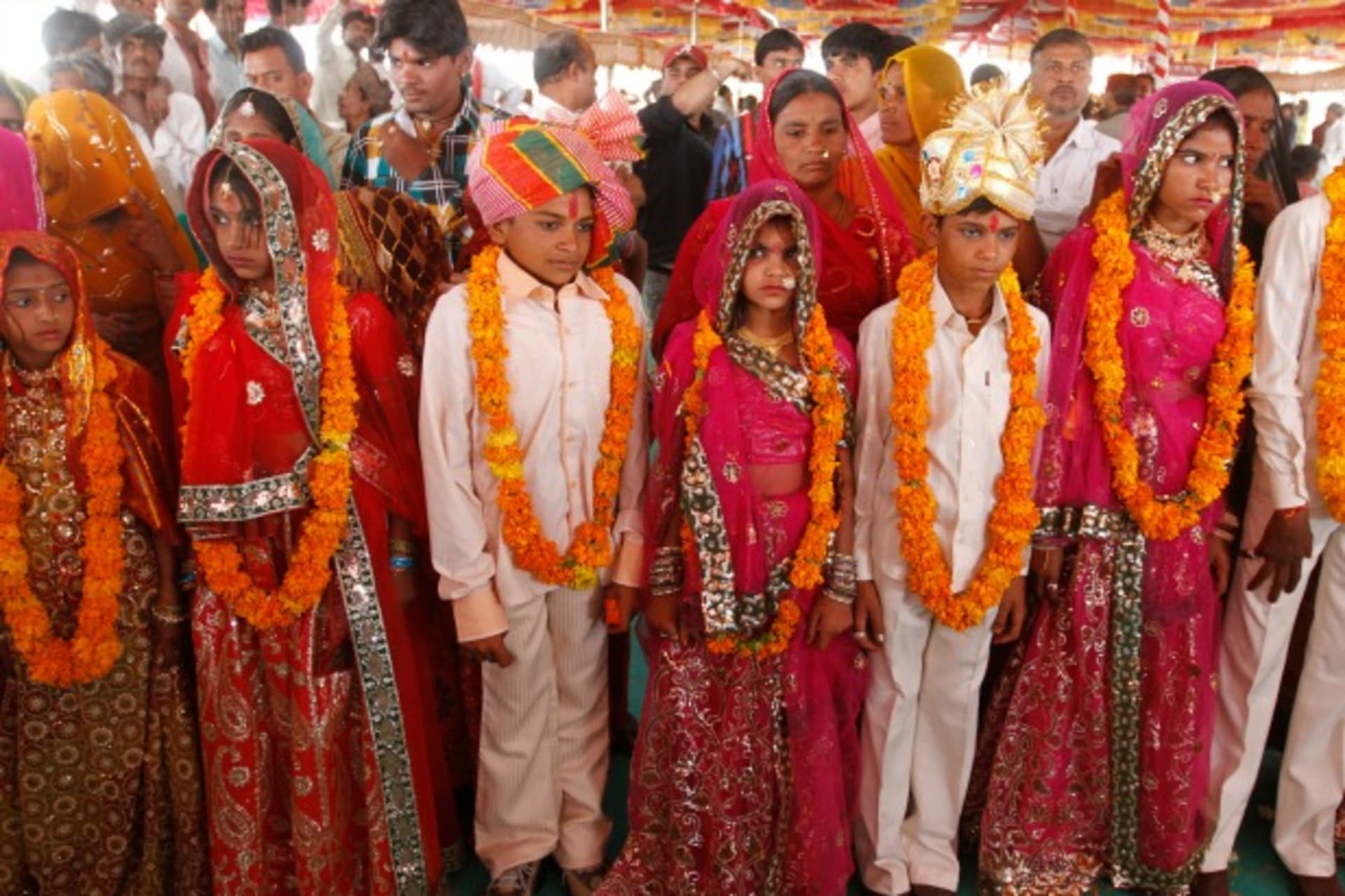<p>Boys and girls pose for pictures after their engagement ceremony in the western Indian state of Gujarat, March 2012 (Courtesy Reuters/Amit Dave).</p>
