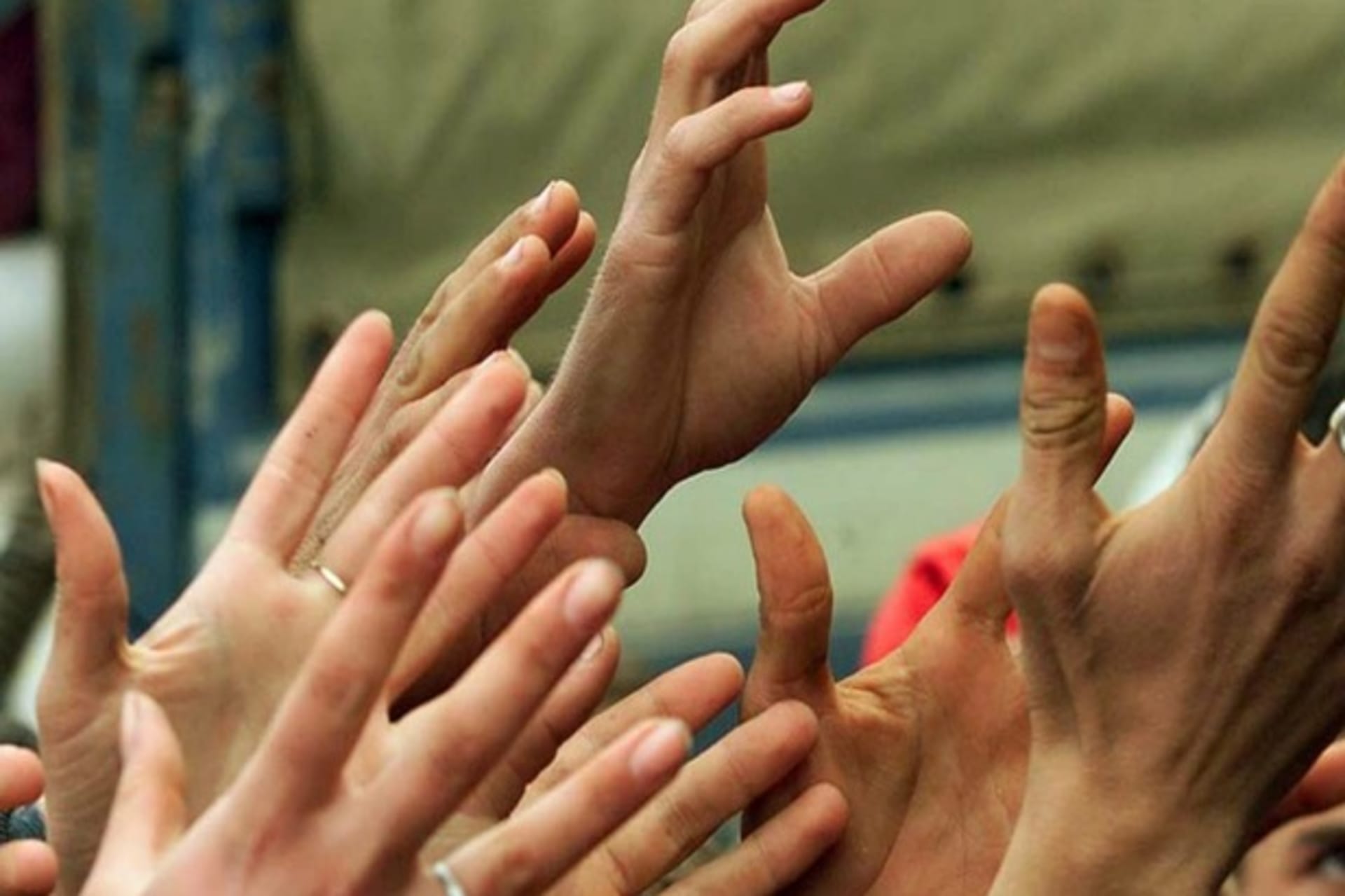 <p>Outstretched hands, Kukes, Albania, 1999 (Courtesy Reuters).</p>
