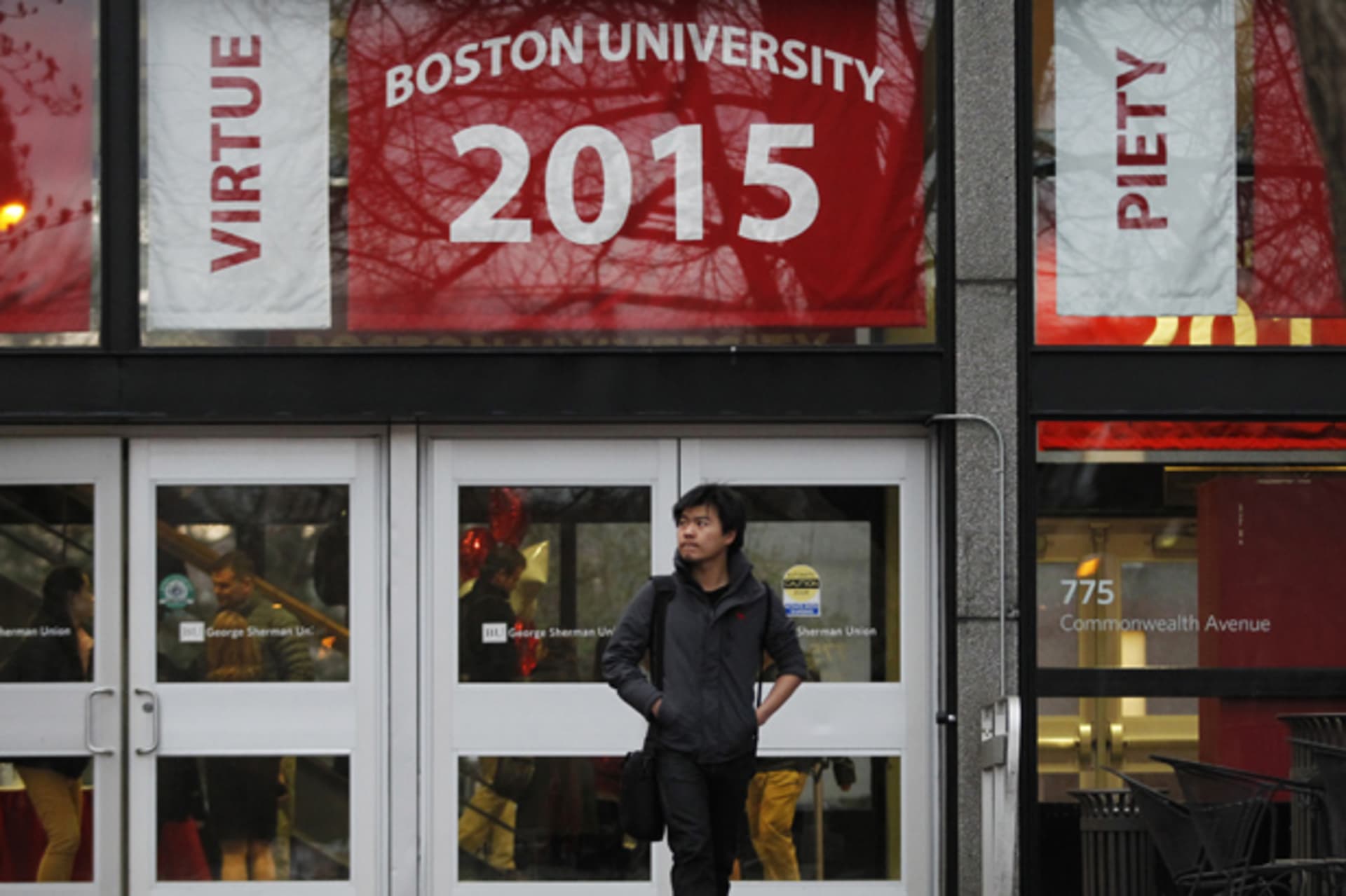 <p>A student walks along Boston University’s campus in Boston, Massachusetts (Jessica Rinaldi/Courtesy Reuters).</p>
