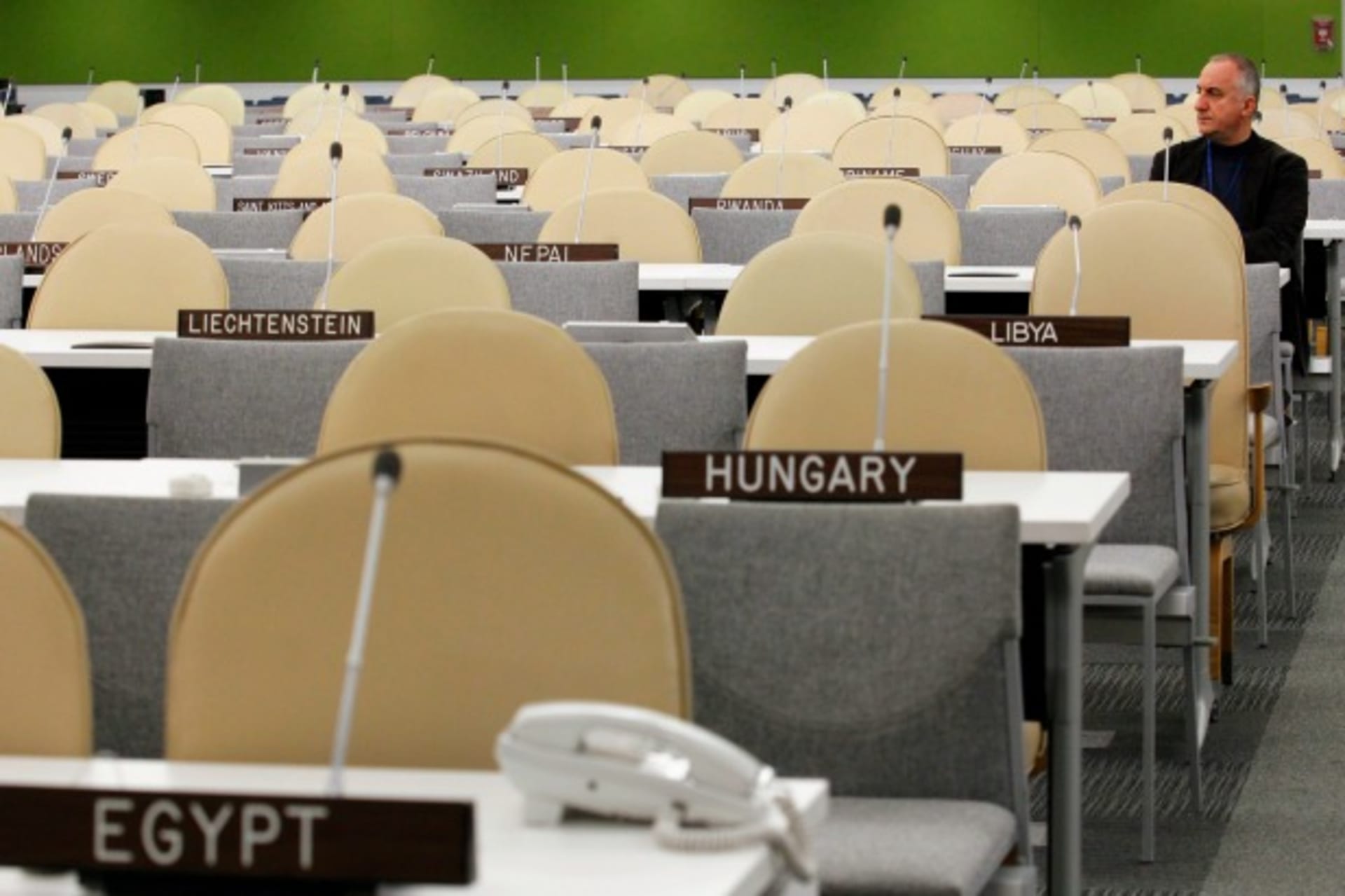 <p>A UN worker rests after checking the temporary General Assembly Hall at the UN headquarters in New York, September 22, 2013 (Courtesy Reuters/Eduardo Munoz).</p>
