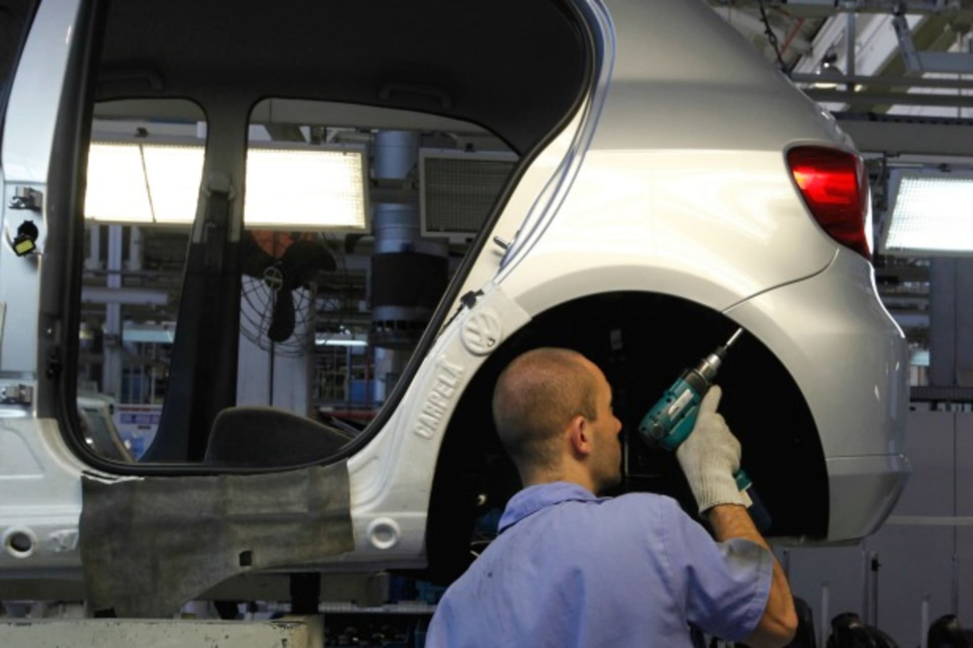 <p>A Brazilian worker assembles a Volkswagen car in Sao Paulo, Brazil, April 2011 (Courtesy Reuters/Nacho Doce).</p>

