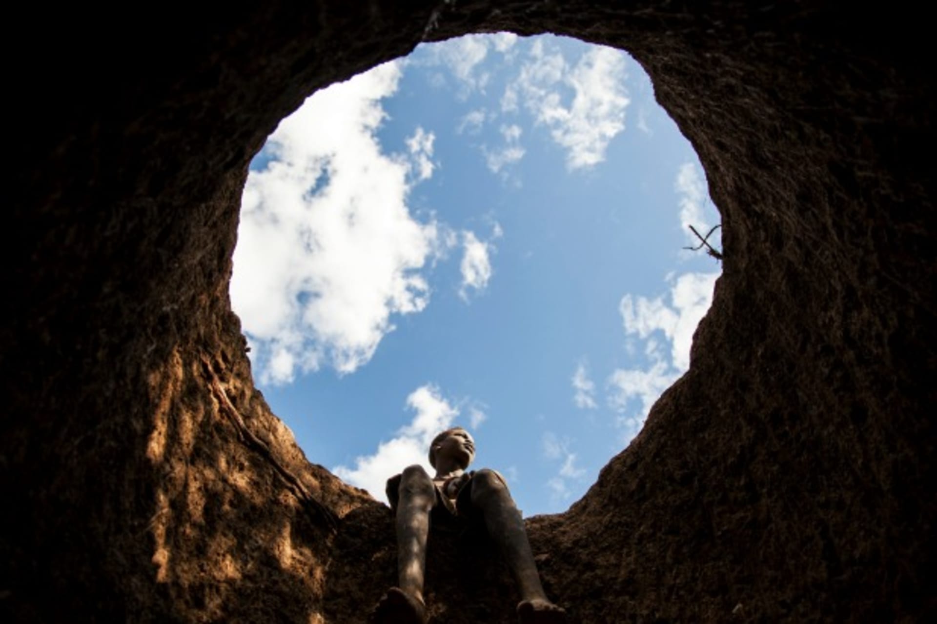 <p>A boy takes a rest after digging for gold in Napotpot, South Sudan October 2012 (Courtesy Reuters/Adriane Ohanesian).</p>
