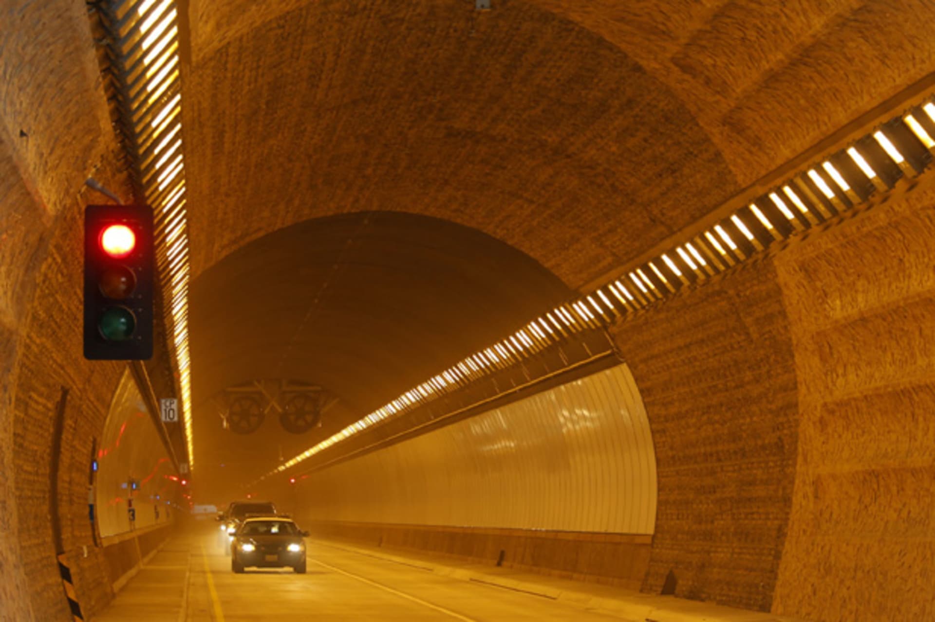 <p>A police vehicle escorts visitors through one of two tunnels that will replace a stretch of California’s Highway 1 near Pacifica, California on March 25, 2013 (Robert Galbraith/Courtesy Reuters).</p>
