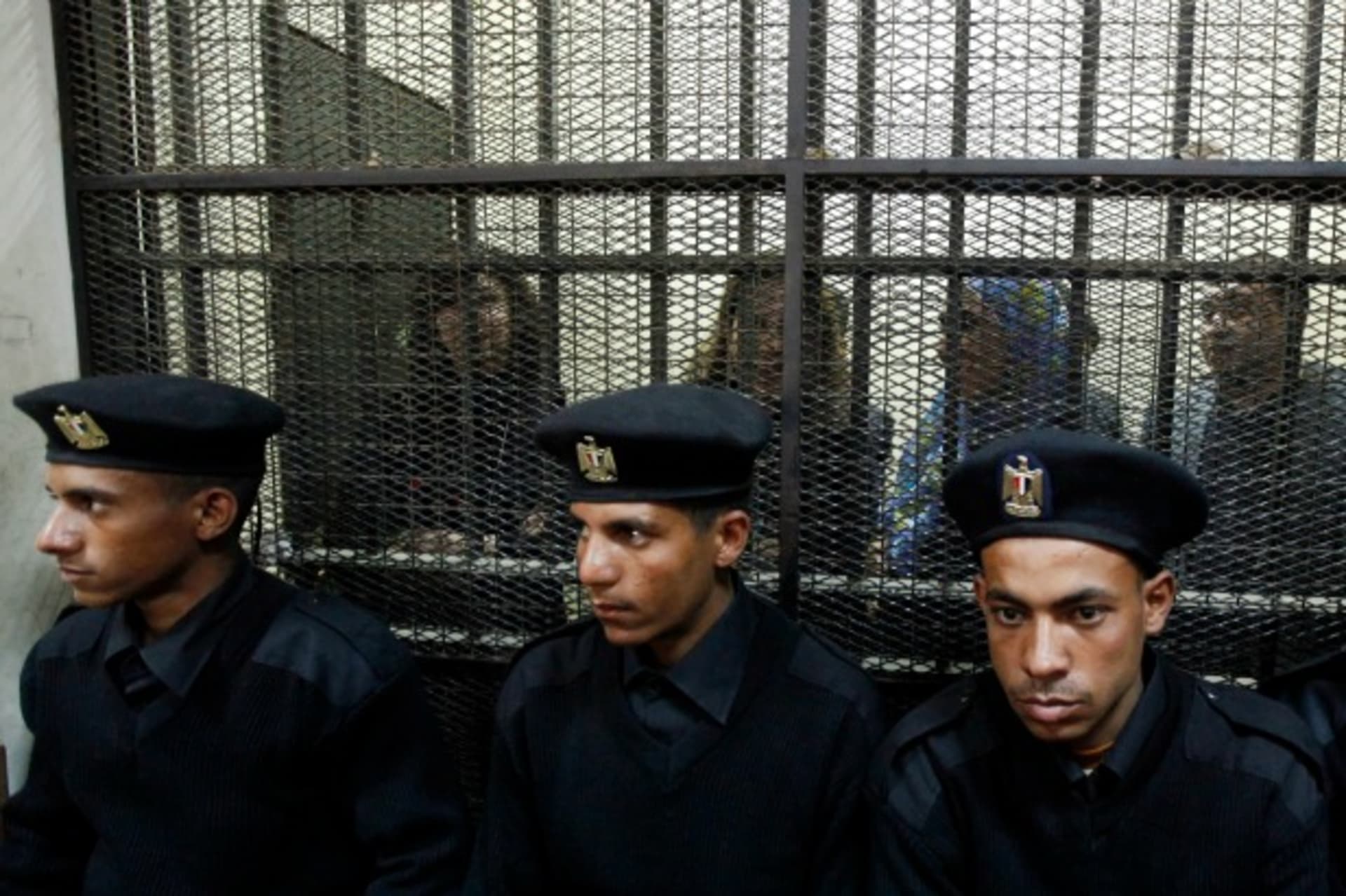 <p>NGO workers behind bars in Egypt, February 2012 (Courtesy Reuters/Mohamed Abd El Ghany).</p>
