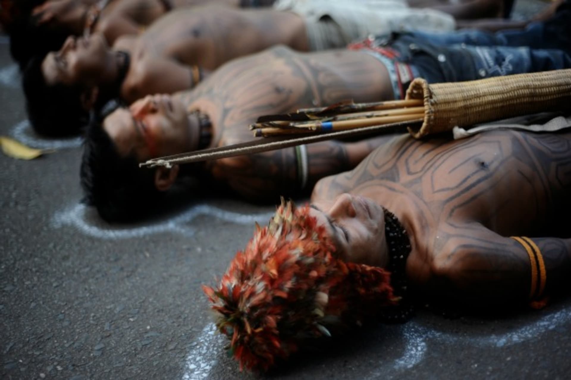 <p>Amazon Indians in front of the Ministry of Mines and Energy in Brasilia, Brazil, protesting the construction of the Belo Monte hydroelectric plant, June 2013 (Courtesy Reuters/Lunae Parracho).</p>
