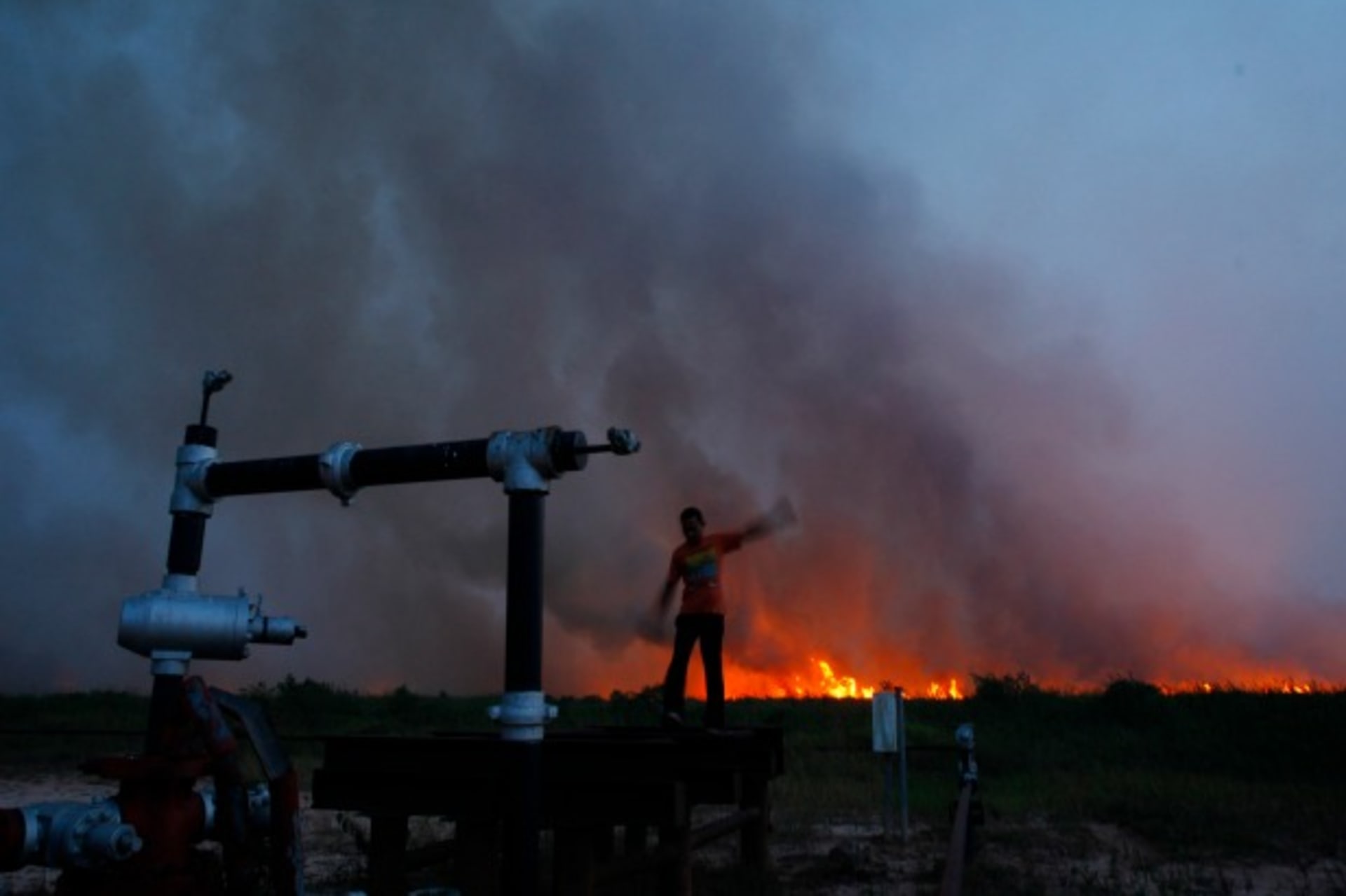 A burning palm oil plantation in Indonesia, June 2013 (Beawiharta/Courtesy Reuters).