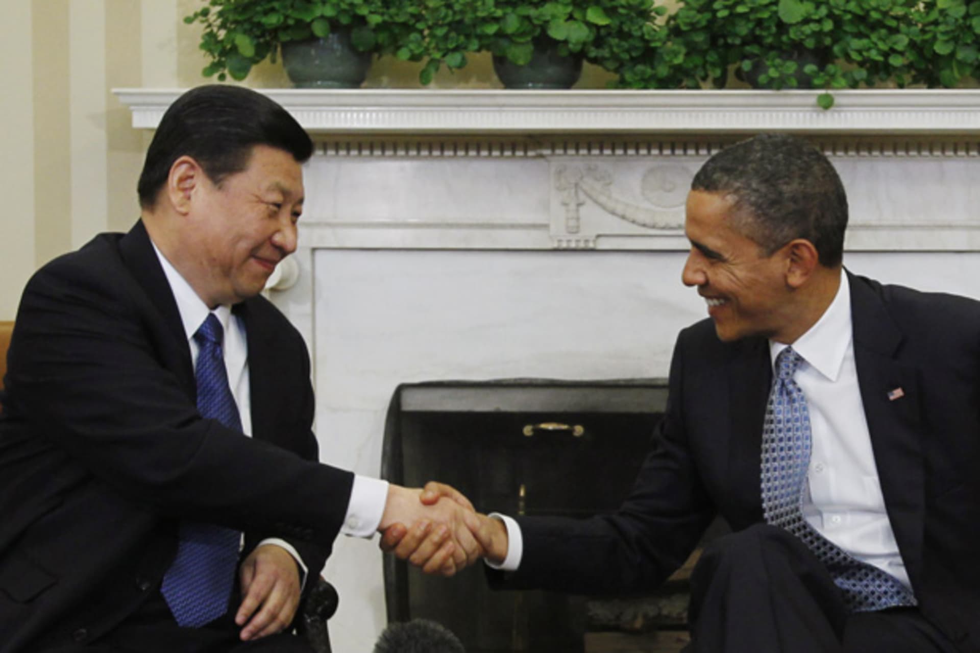 <p>President Barack Obama shakes hands with then-Vice President of China Xi Jinping in the Oval Office on February 14, 2012 (Jason Reed/Courtesy Reuters).</p>
