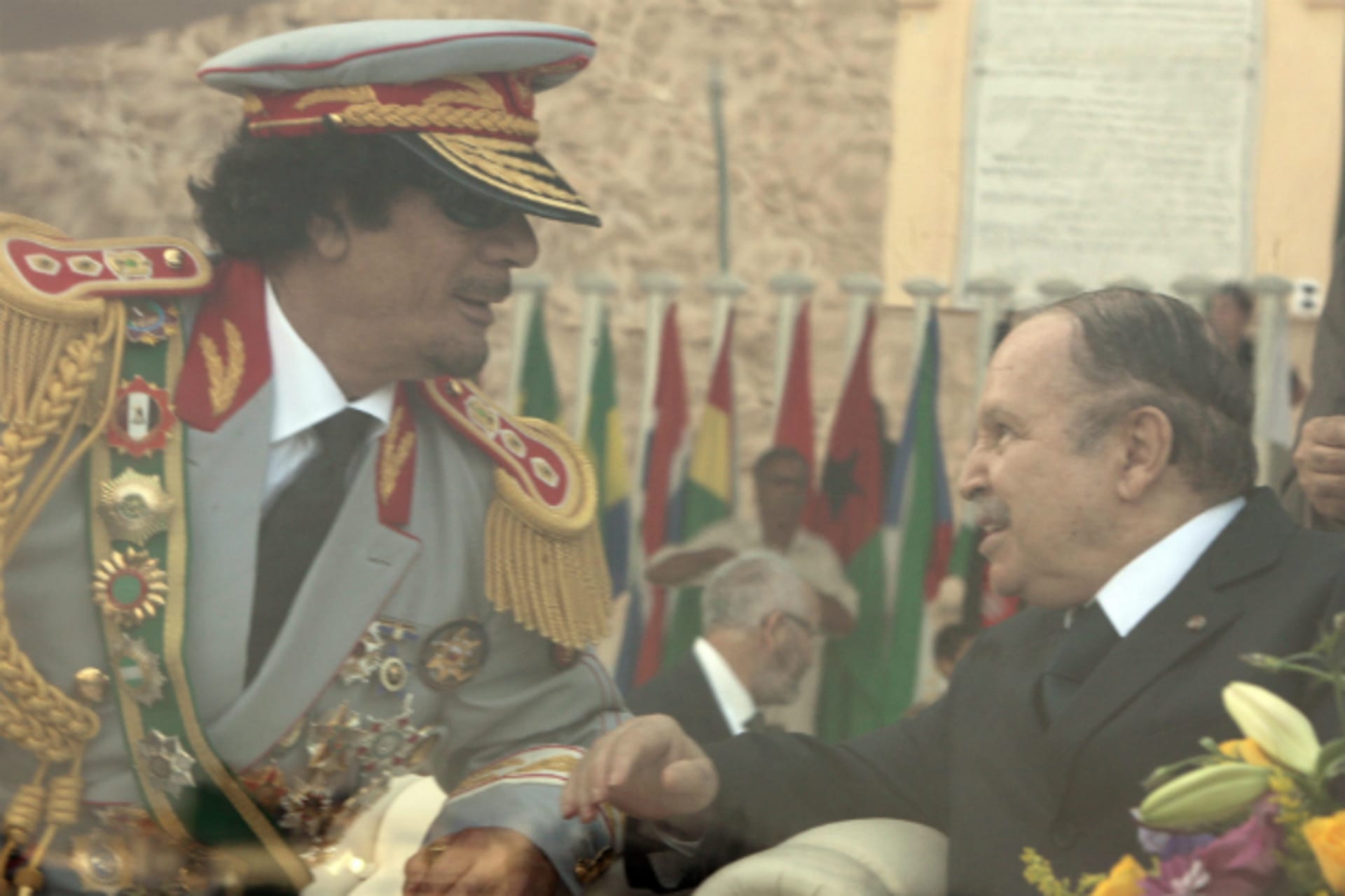 <p>Libya’s leader Muammar Gaddafi (L) talks to Algeria’s President Abdelaziz Bouteflika during celebrations of the 40th anniversary of Gaddafi coming to power, at the Green Square in Tripoli September 1, 2009. (Courtesy REUTERS/Zohra Bensemra)</p>
