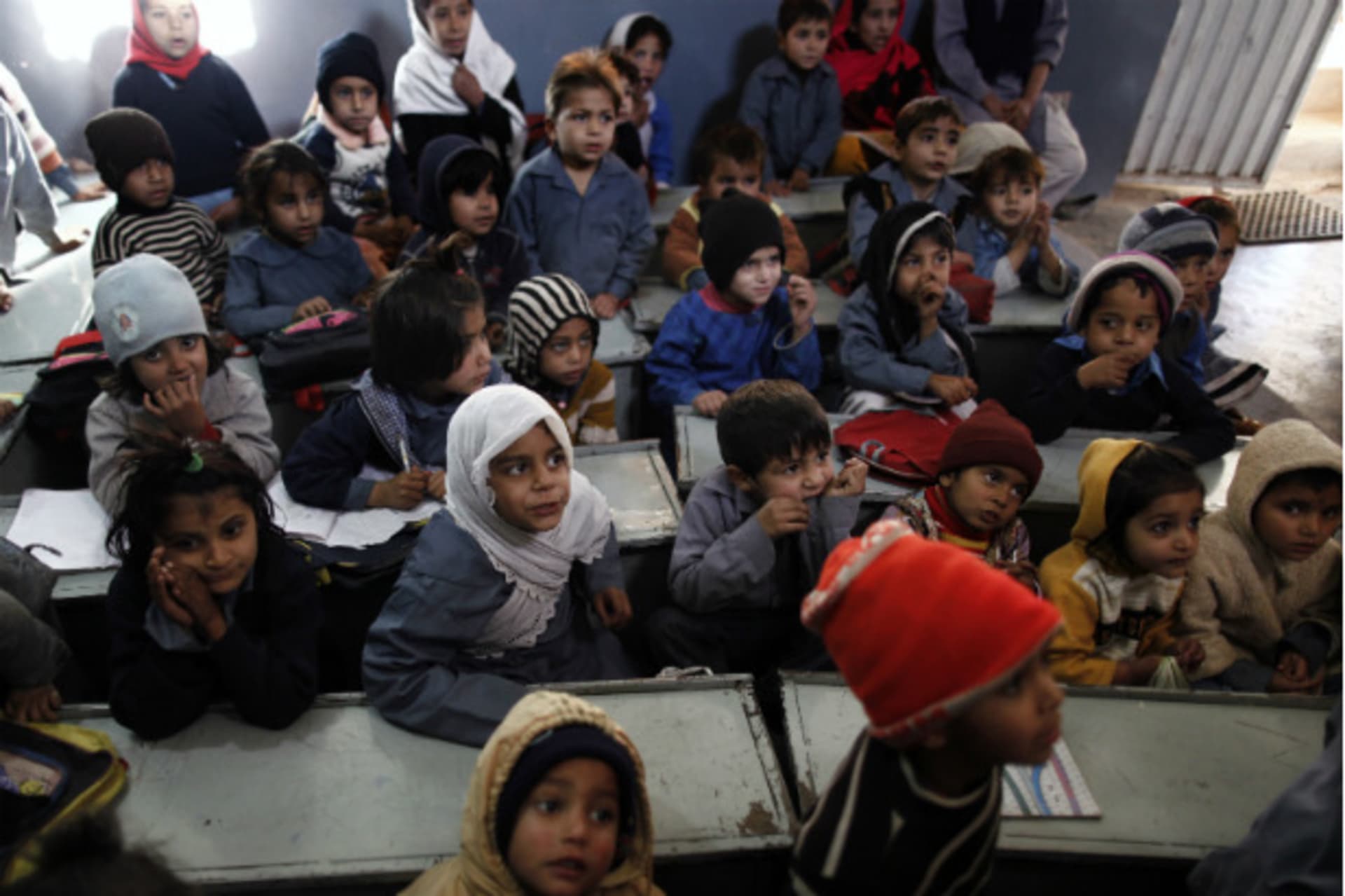 <p>Children from underprivileged background attend a playgroup class at Mashal School on the outskirts of Islamabad, Pakistan on January 24, 2013 (Zohra Bensemra/Courtesy Reuters).</p>