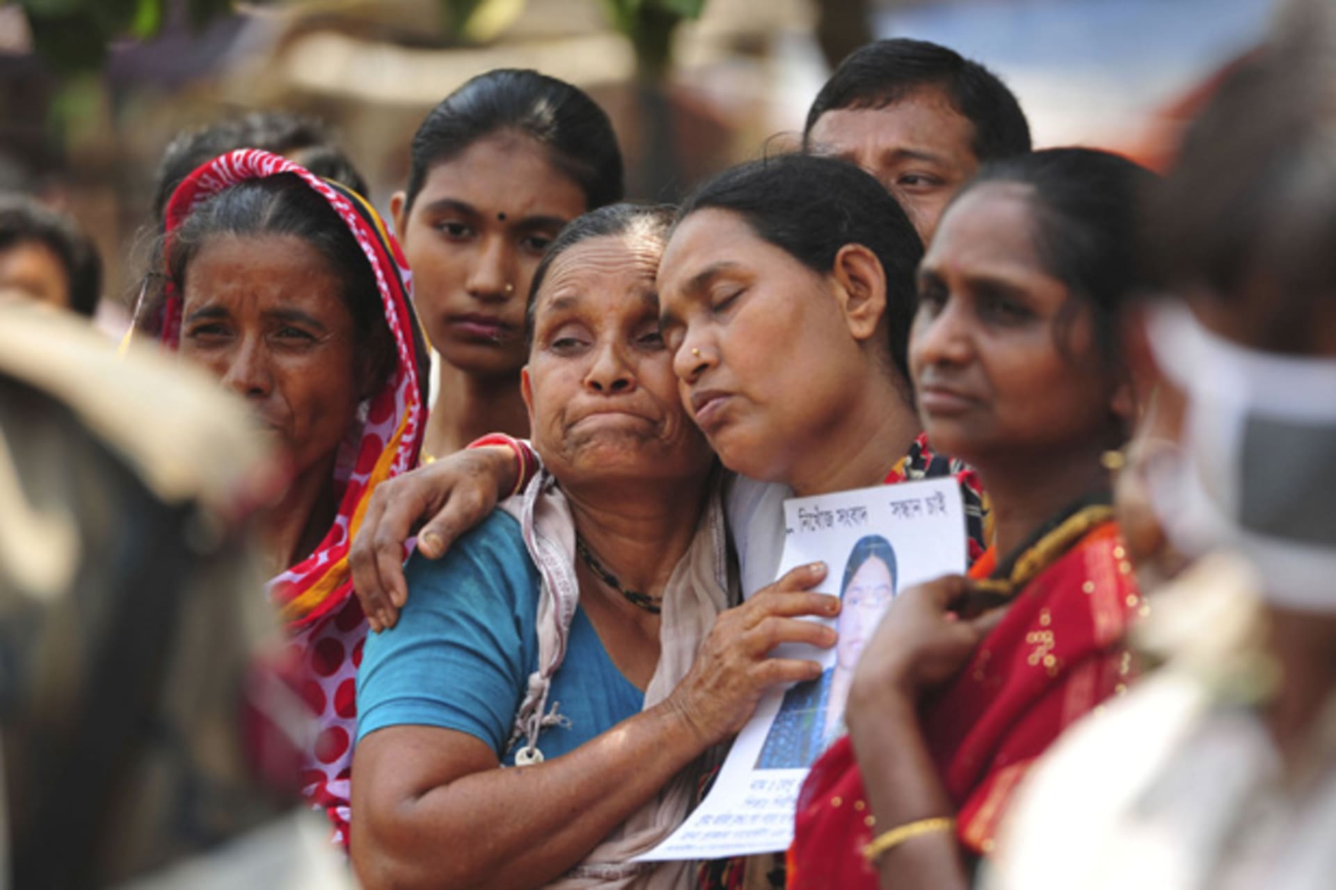 <p>Relatives mourn as they look for a missing garment worker after the collapse of the Rana Plaza building in Savar, outside Dhaka, Bangladesh on May 2, 2013 (Khurshed Rinku/Courtesy Reuters).</p>
