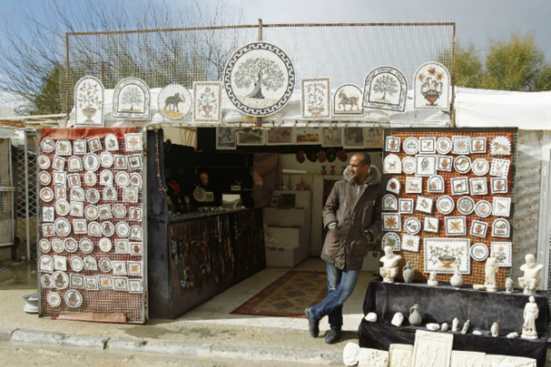 <p>A man waits for tourists to visit his souvenir shop in Carthage, near Tunis, Tunisia February 10, 2013 (Zoubeir Souissi/Courtesy Reuters).</p>
