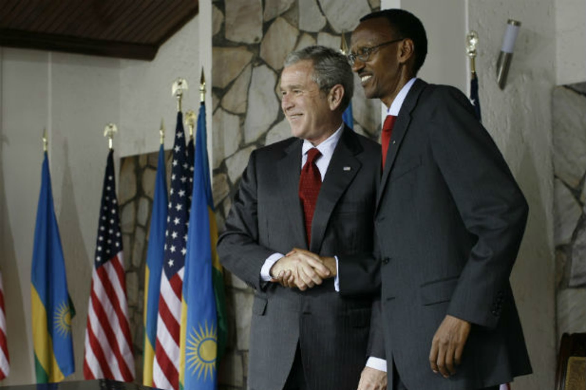 <p>U.S. President George W. Bush shakes hands with Rwandan President Paul Kagame after signing a bilateral investment treaty during a news conference at the Presidency in Kigali February 19, 2008 (Jason Reed/Courtesy Reuters).</p>
