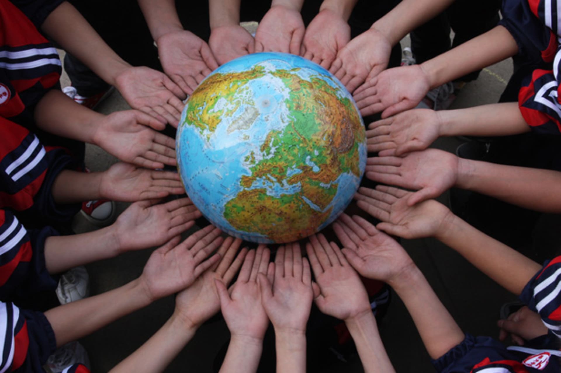 <p>Chinese students pose for the photo with a globe during a campaign to mark World Earth Day (China Daily/Courtesy Reuters).</p>
