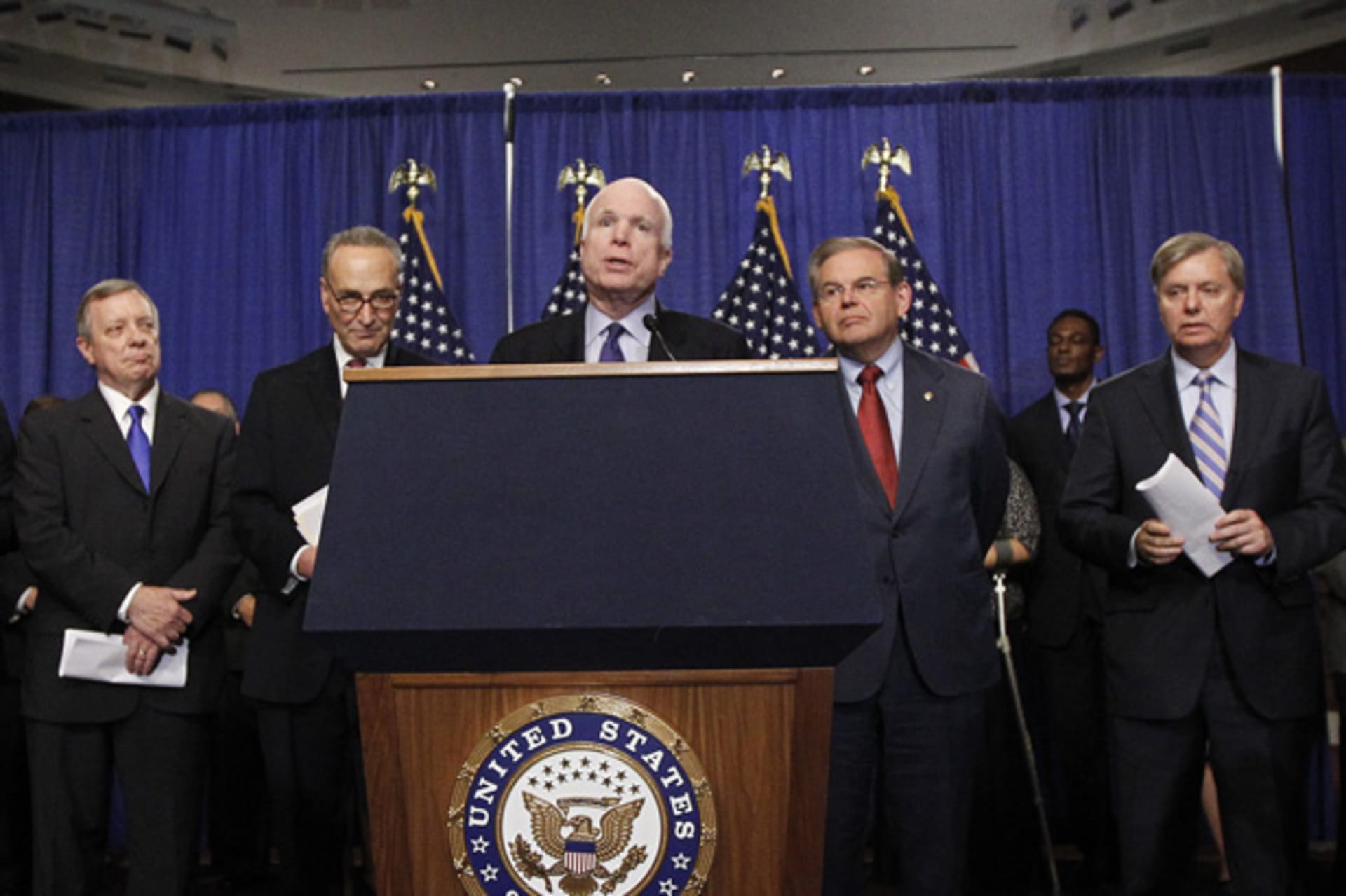 Members of the Senate "Gang on Eight"--Dick Durbin (R-FL), Chuck Schumer (D-NY), John McCain (R-AZ), Bob Menendez (D-NJ), and Lindsey Graham (R-SC)--are pictured during a news briefing on Capitol Hill to discuss their proposed immigration bill