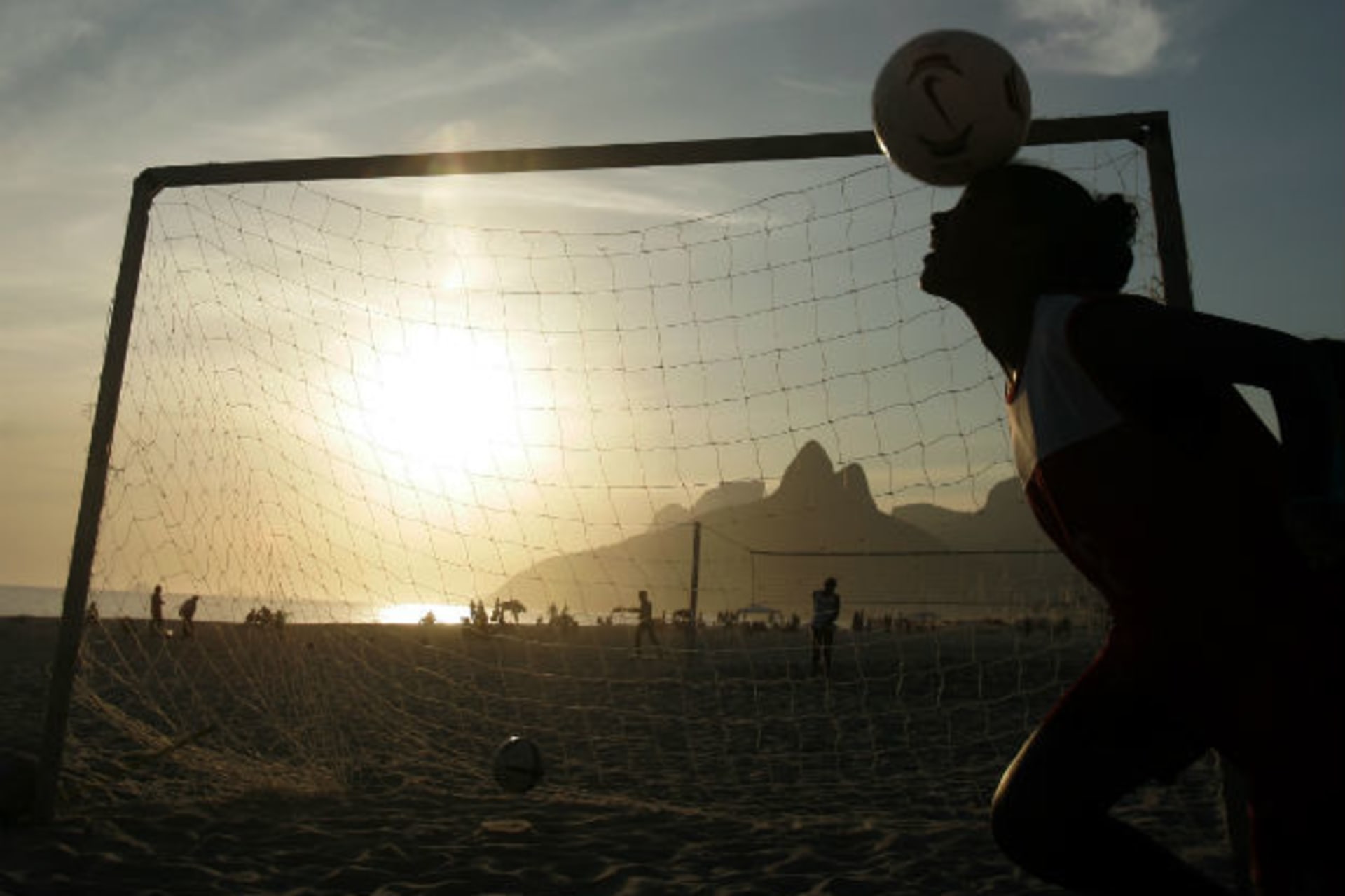 <p>A Brazilian girl plays soccer at sunset on Ipanema beach in Rio de Janeiro on November 25, 2004 (Sergio Moraes/Courtesy Reuters).</p>
