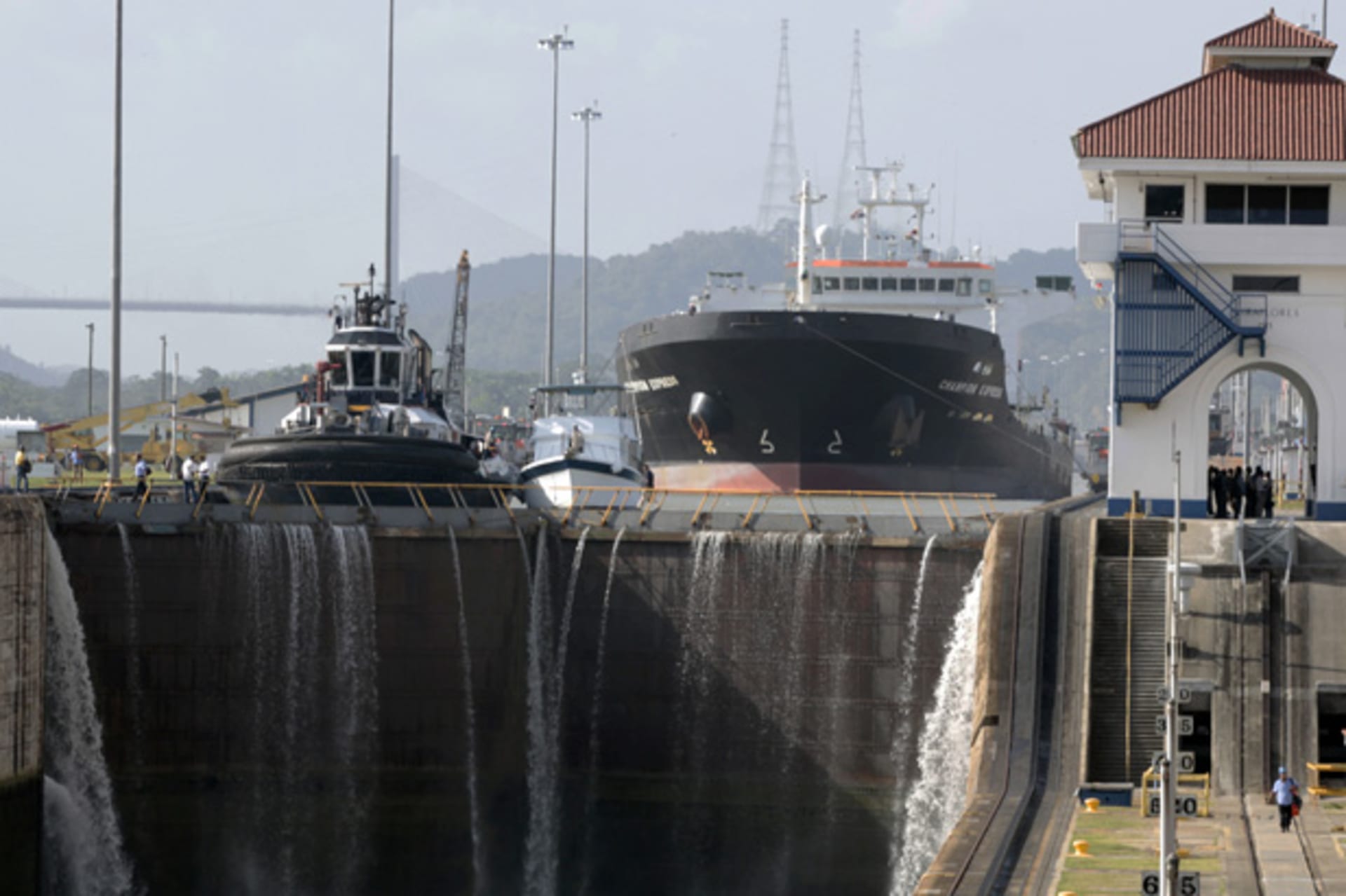 <p>A cargo ship waits to pass through the Miraflores Locks in the Panama Canal (Alberto Lowe/Courtesy Reuters).</p>
