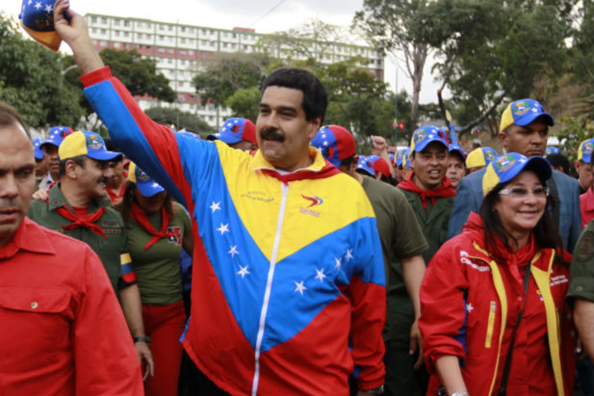 <p>Venezuelan Vice President Nicolas Maduro (C) greets supporters next to his wife Cilia Flores (R) during a parade to commemorate the 21st anniversary of President Hugo Chavez’s attempted coup d’etat in Caracas (Carlos Garcia Rawlins/Courtesy Reuters).</p>