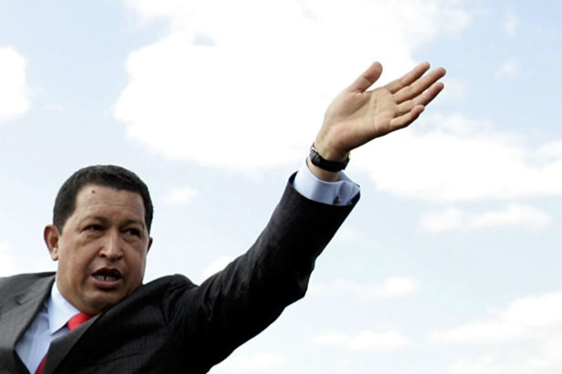 <p>Venezuela’s President Hugo Chavez waves to supporters during his arrival at Toncontin airport in Tegucigalpa (Edgard Garrido/Courtesy Reuters)</p>
