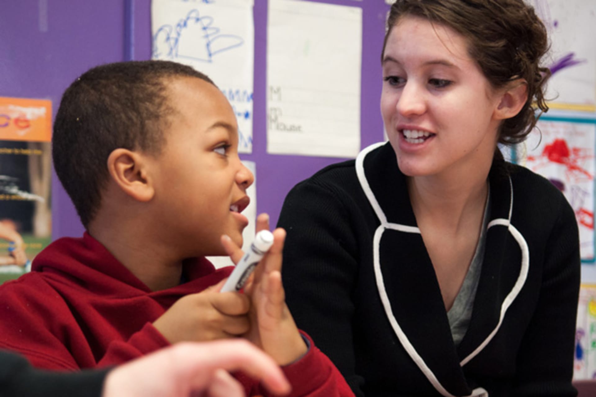<p>A student from Boston College volunteers at Ellis Memorial Center (supportunitedway/Flickr).</p>