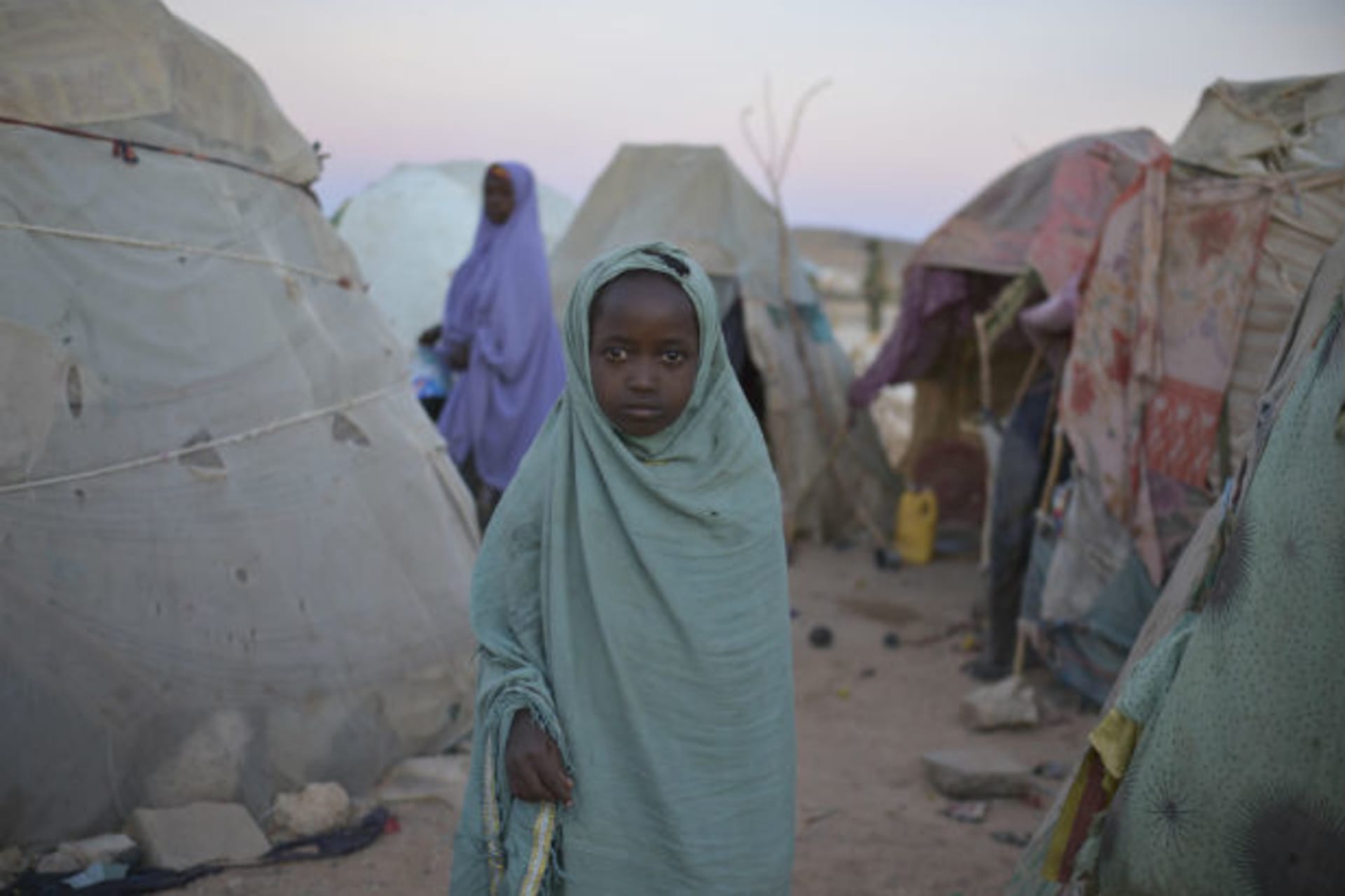 <p>A girl stands in a camp for internally displaced persons (IDP) on the outskirts of Belet Weyne, about 315 km (196 miles) from …this picture provided by the African Union-United Nations Information Support (AU-UN IST) team (Tobin Jones/Courtesy Reuters).</p>
