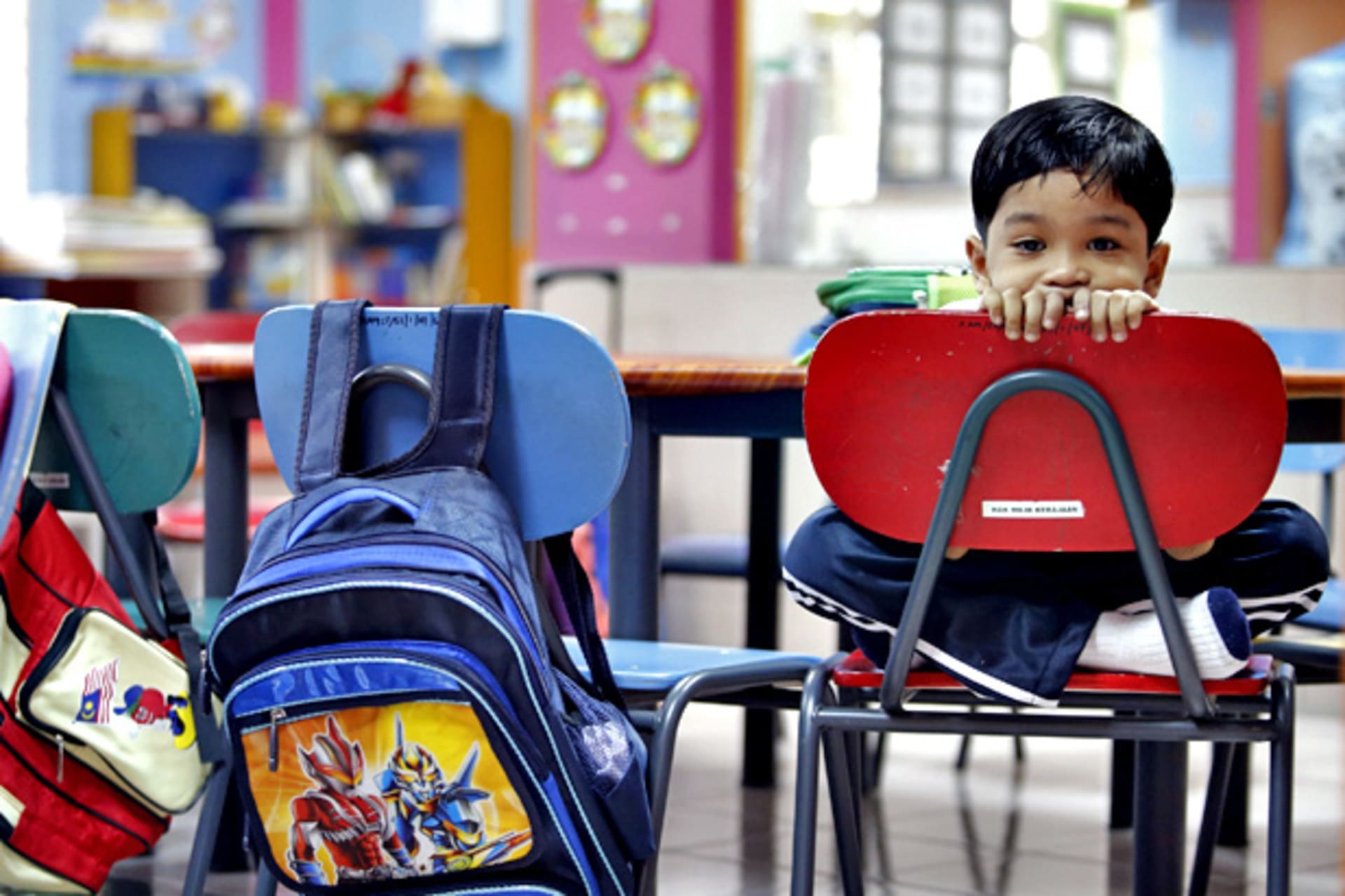 <p>A preschooler on his first day of school in Kuala Lumpur, Malaysia (Bazuki Muhammad/Courtesy Reuters).</p>

