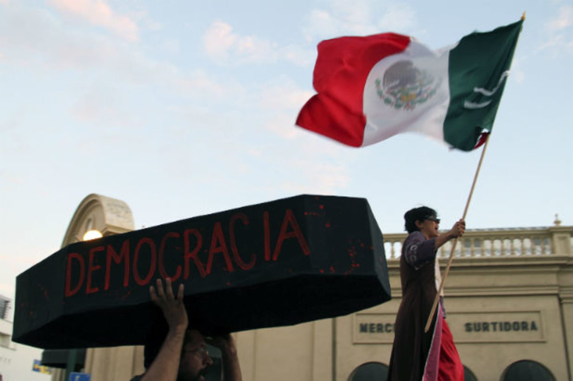 <p>A protester holds a symbolic coffin who reads “democracy” during a demonstration in support of Andres Manuel Lopez Obrador, runner-up in Mexico’s presidential race, after a court threw out his challenge to the poll result, in Hermosillo September 1, 2012.</p>

