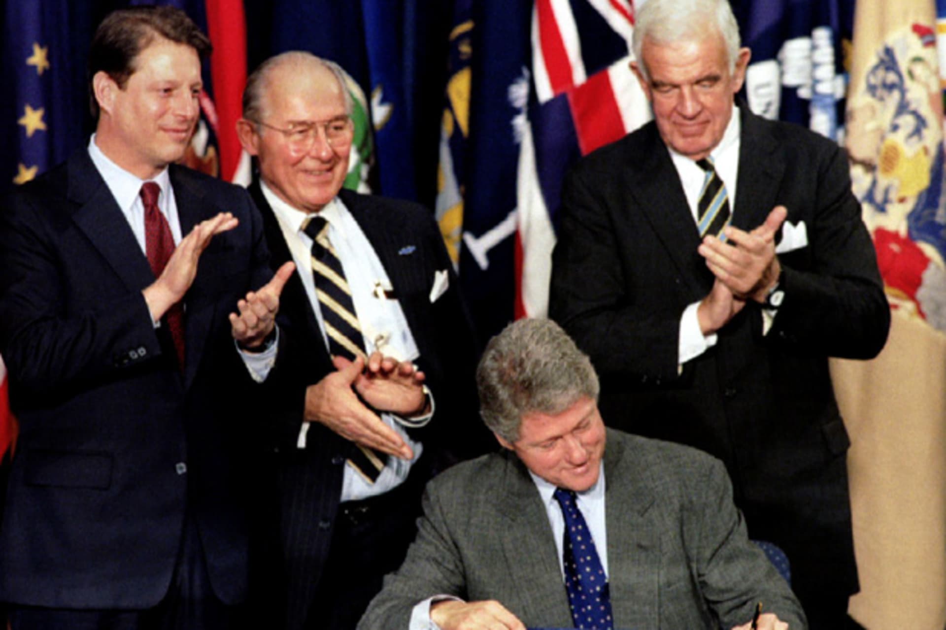 <p>President Clinton signs the North American Free Trade Agreement (NAFTA) into law on December 8, 1993 (Mike Theiler/Courtesy Reuters).</p>

