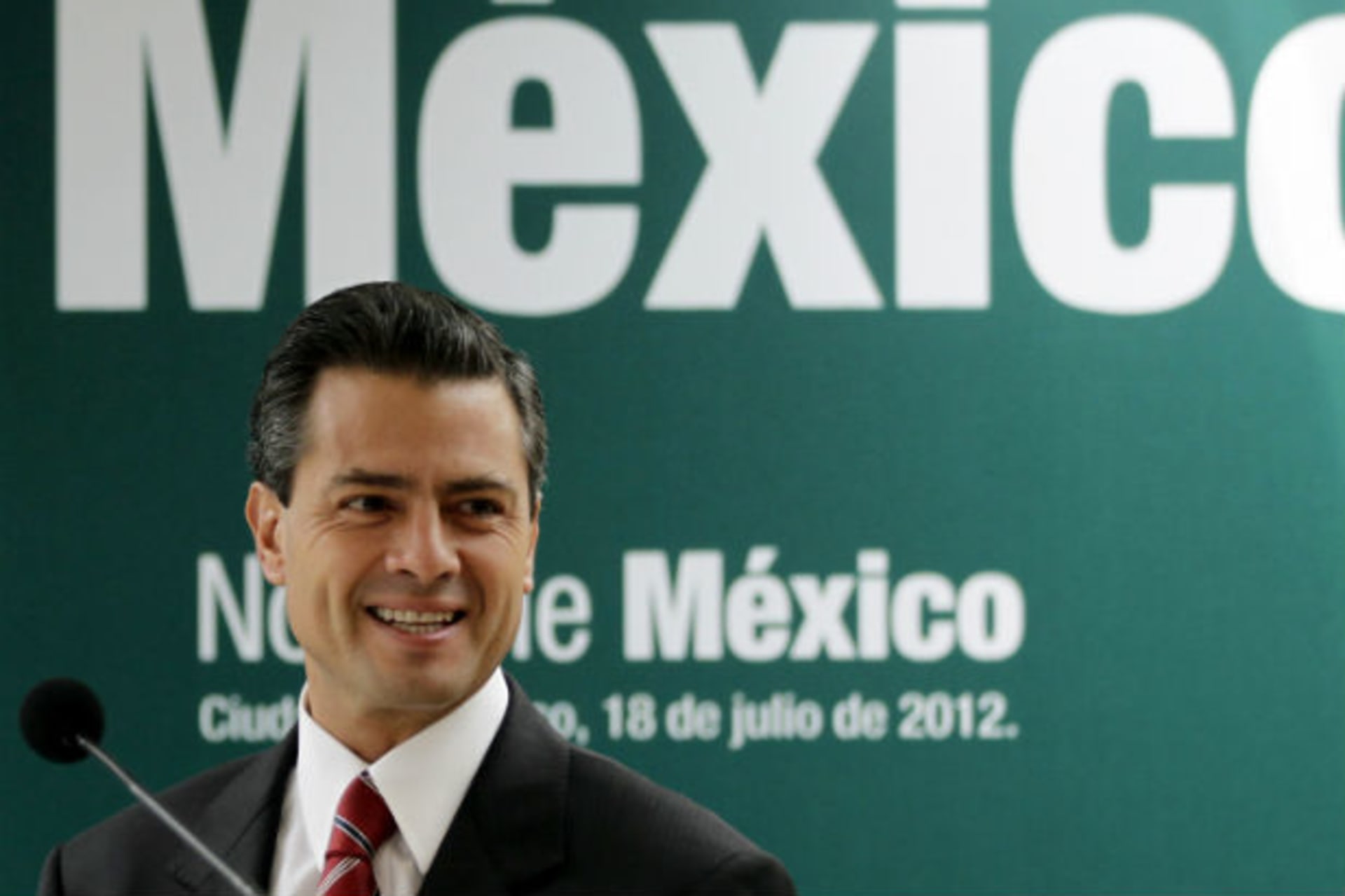 <p>Mexico’s President-elect Enrique Pena Nieto smiles during a news conference in Mexico City</p>
