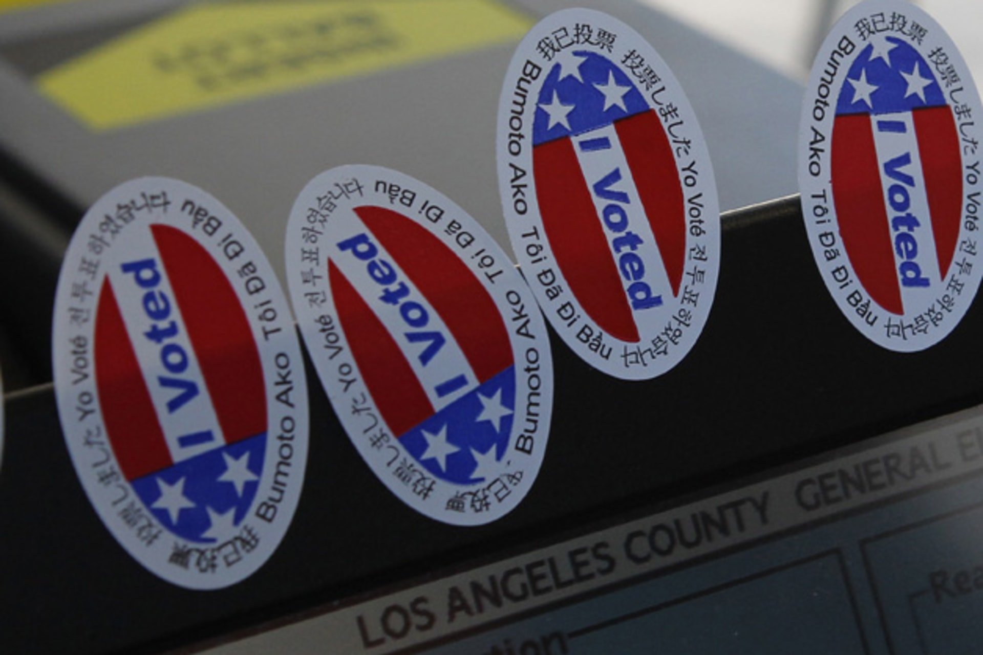 <p>Stickers stating “I Voted” in several languages are affixed to a ballot intake machine during the 2012 national election (Fred Prouser/Courtesy Reuters).</p>
