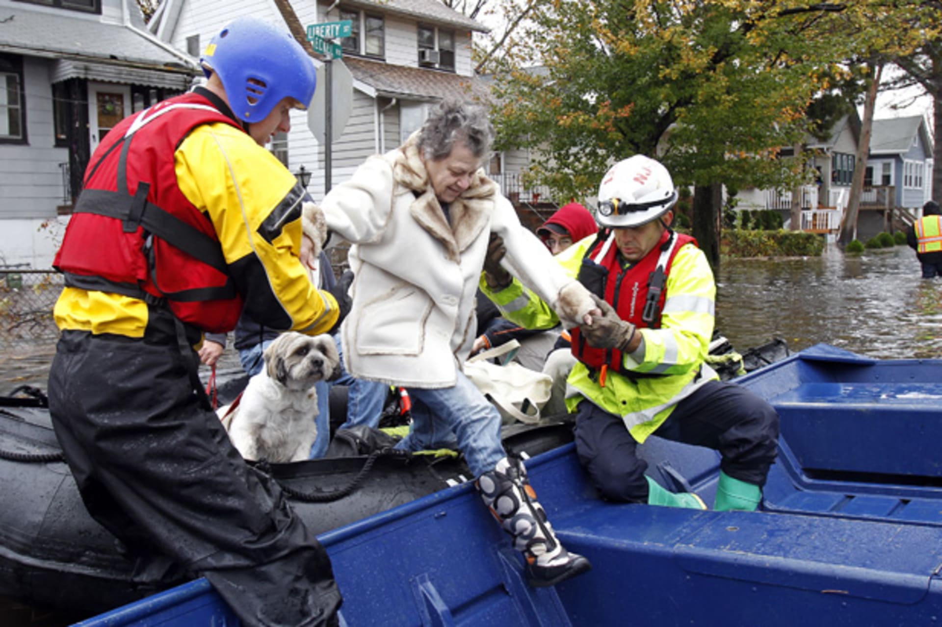 <p>Emergency personnel help a resident onto a boat after rescuing her from flood waters brought on by Hurricane Sandy in Little Ferry, New Jersey on October 30, 2012 (Adam Hunger/Courtesy Reuters).</p>
