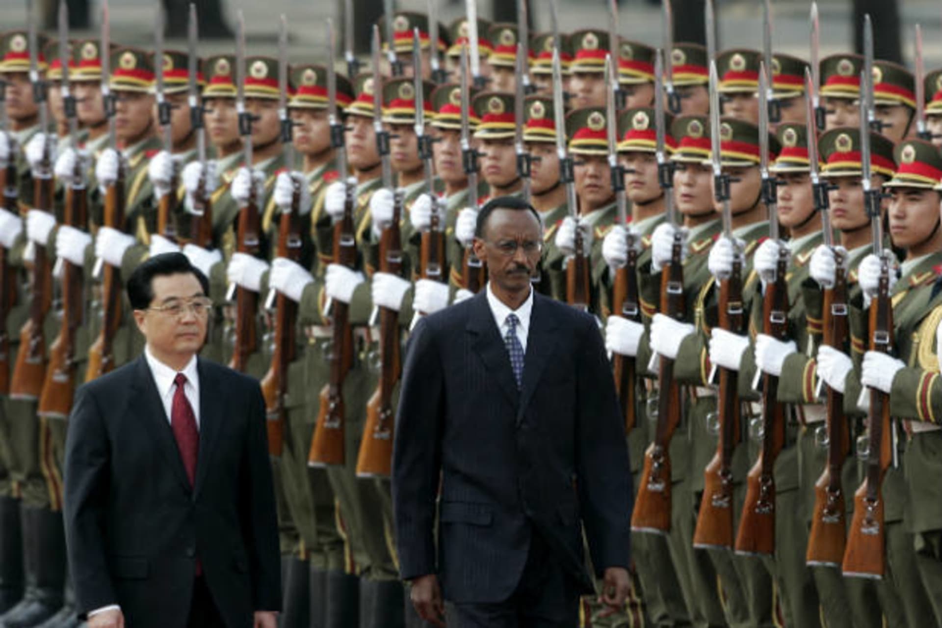 <p>China’s President Hu Jintao and Rwanda’s President Paul Kagame (R) view an honor guard during a welcome ceremony outside the Great Hall of the People in Beijing on May 14, 2007 (Jason Lee/Courtesy Reuters).</p>
