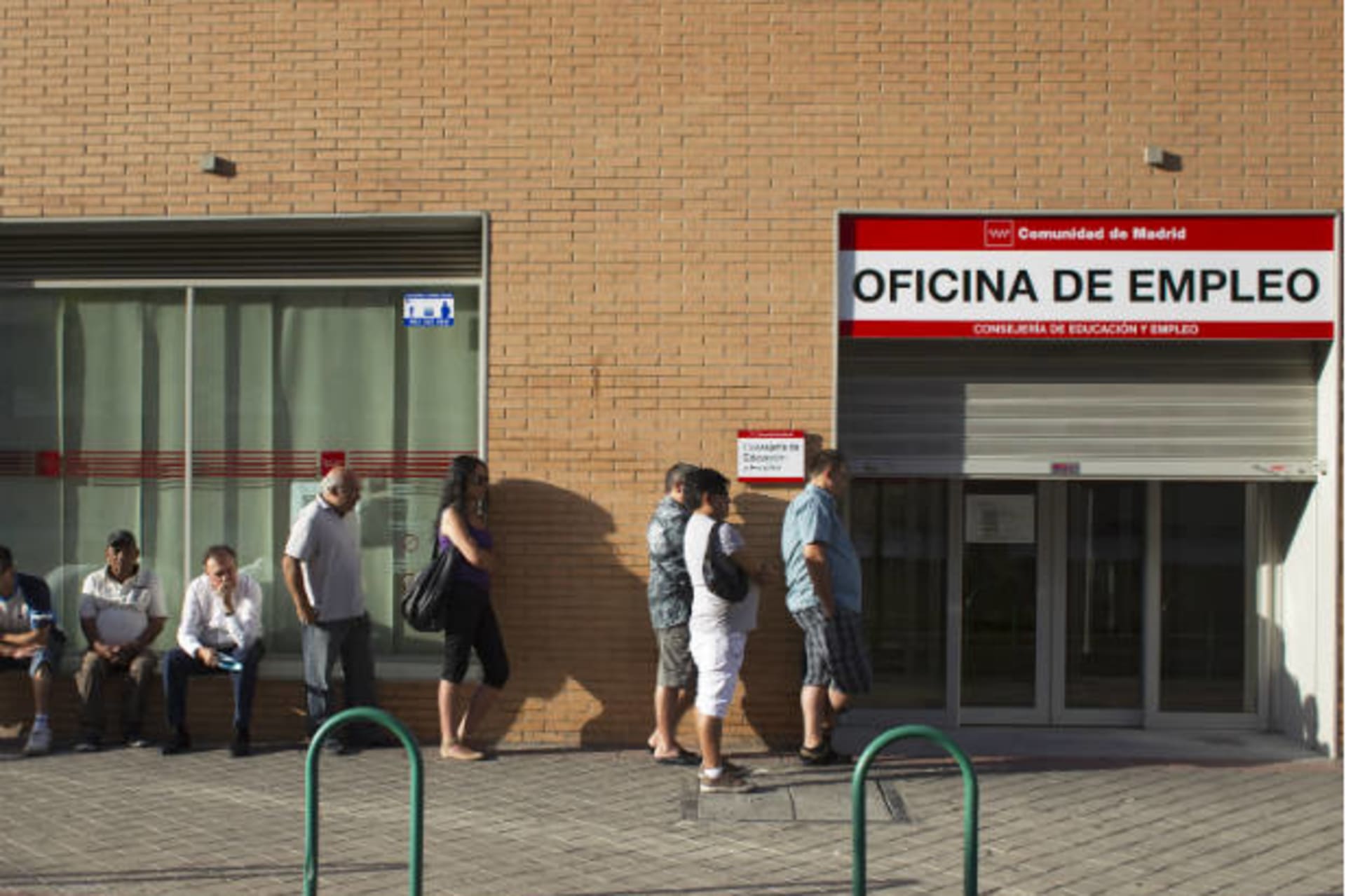 <p>People queue to enter a government-run employment office in Madrid on July 27, 2012 (Juan Medina/Courtesy Reuters).</p>