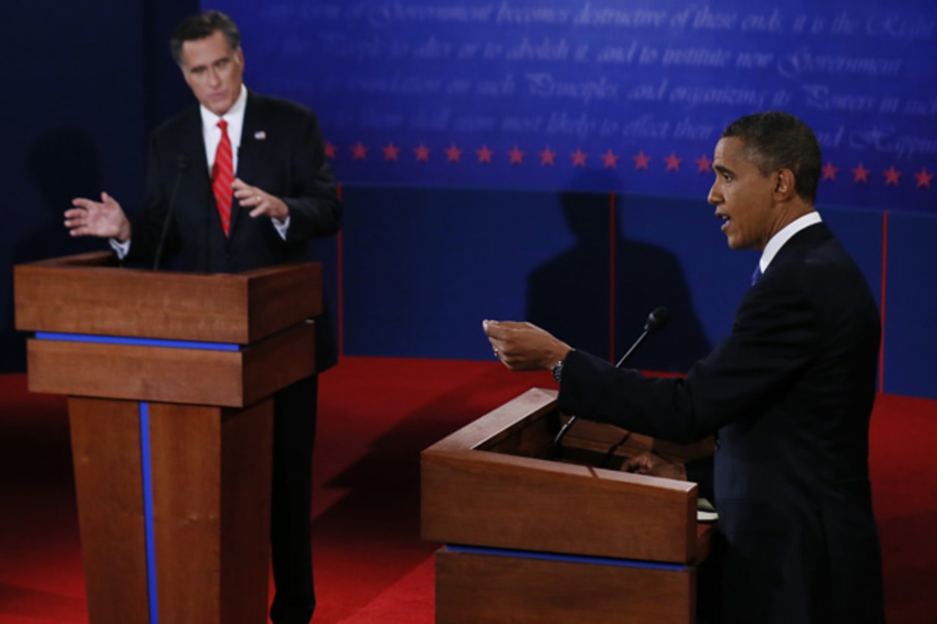 <p>President Barack Obama answers a question as Republican presidential nominee Mitt Romney listens during the first 2012 U.S. presidential debate in Denver on October 3 (Rick Wilking/Courtesy Reuters).</p>
