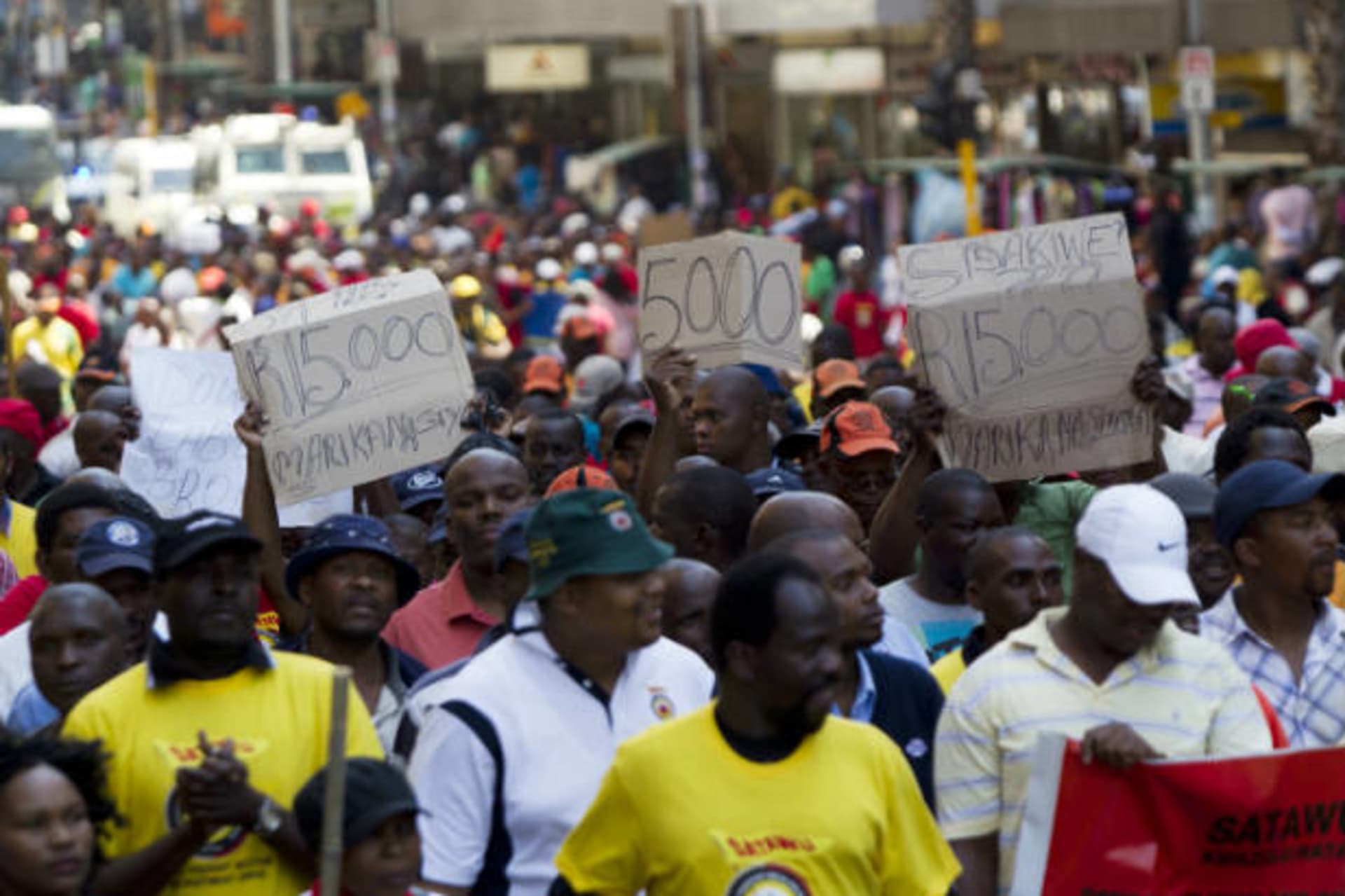 <p>Workers in the freight sector belonging to the South African Transport and Allied Workers Union (SATAWU) march through the Durban central business district, demanding an increase in salary on September 26, 2012 (Rogan Ward/Courtesy Reuters).</p>
