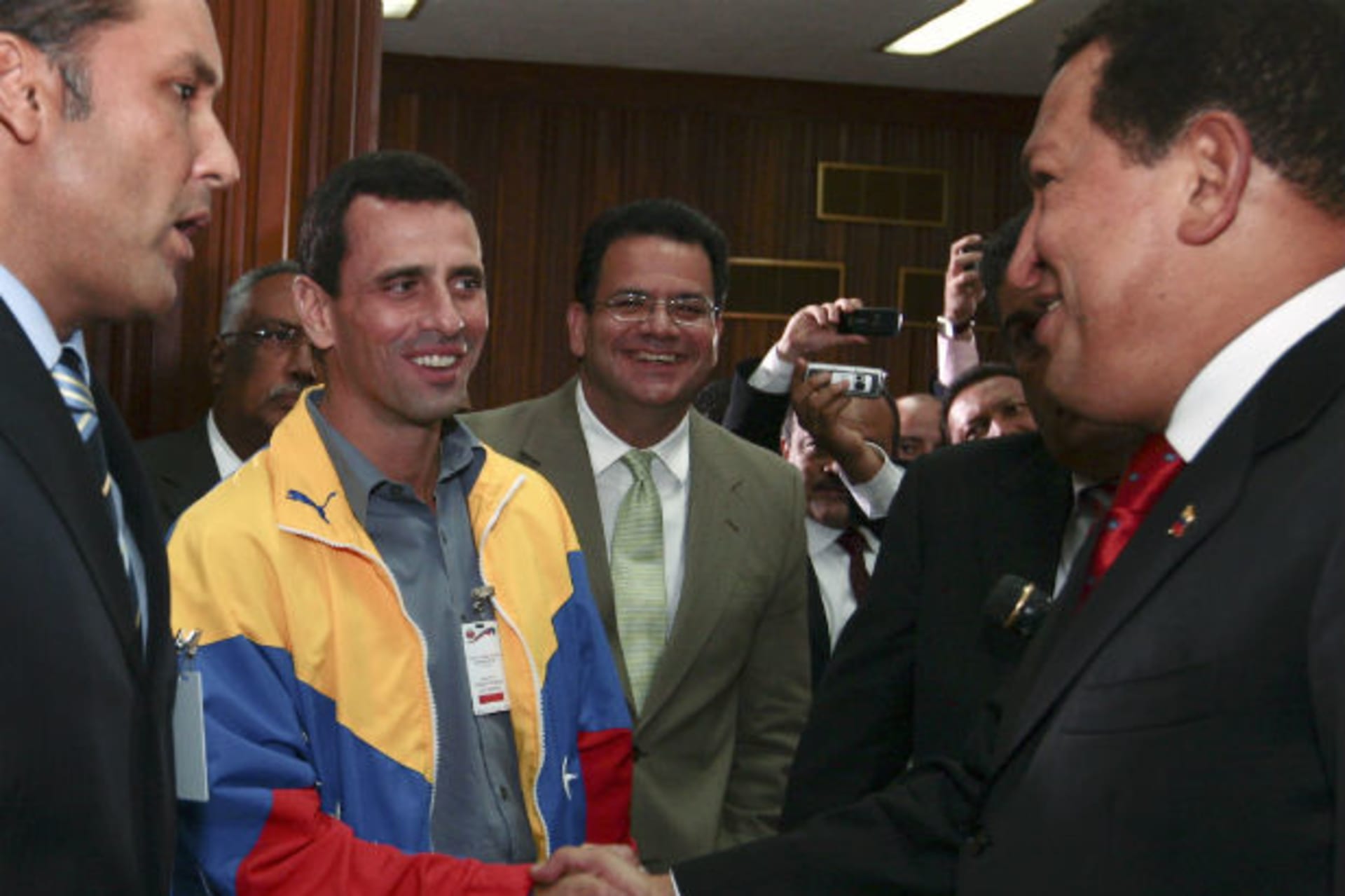 <p>Venezuela’s President Hugo Chavez shakes hands with opposition governor from the state of Miranda, Henrique Capriles, during a ceremony at Miraflores Palace in Caracas</p>
