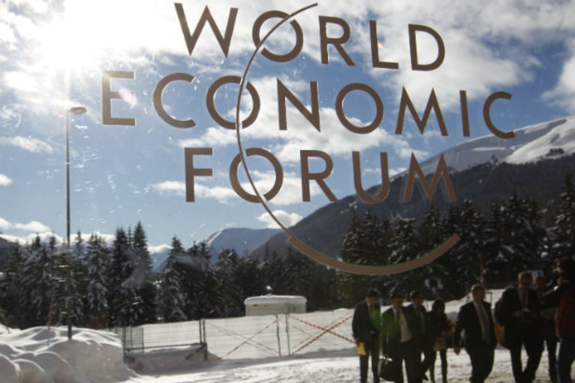 <p>Visitors are reflected in window of the congress center, venue of the World Economic Forum (WEF) in Davos (Arnd Wiegmann/Courtesy Reuters).</p>
