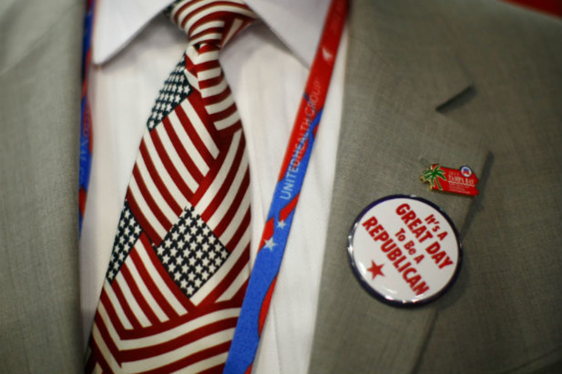 <p>A convention goer wears a button during the second day of the Republican National Convention in Tampa</p>
